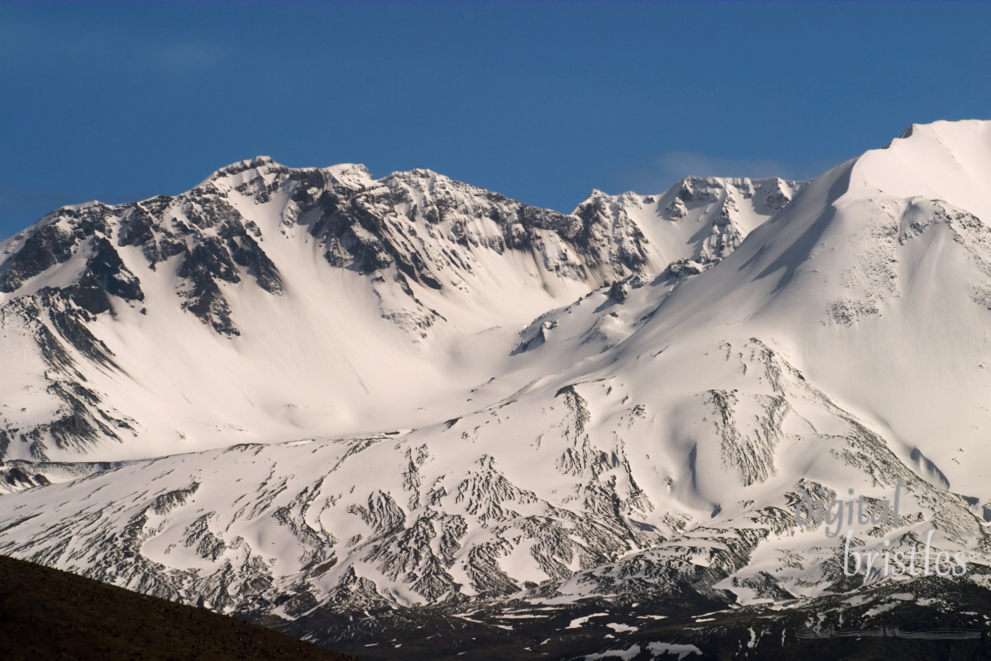 Jagged mountain peaks around the bowl of Mt. St. Helens, Washington