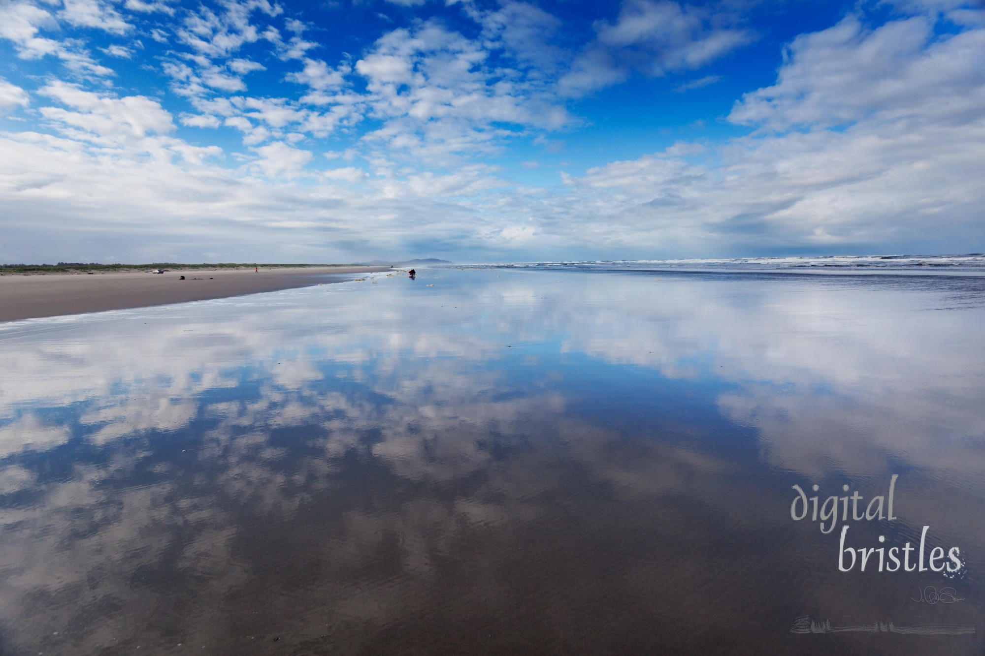 Morning sky over wide wet sands of Long Beach, Washington