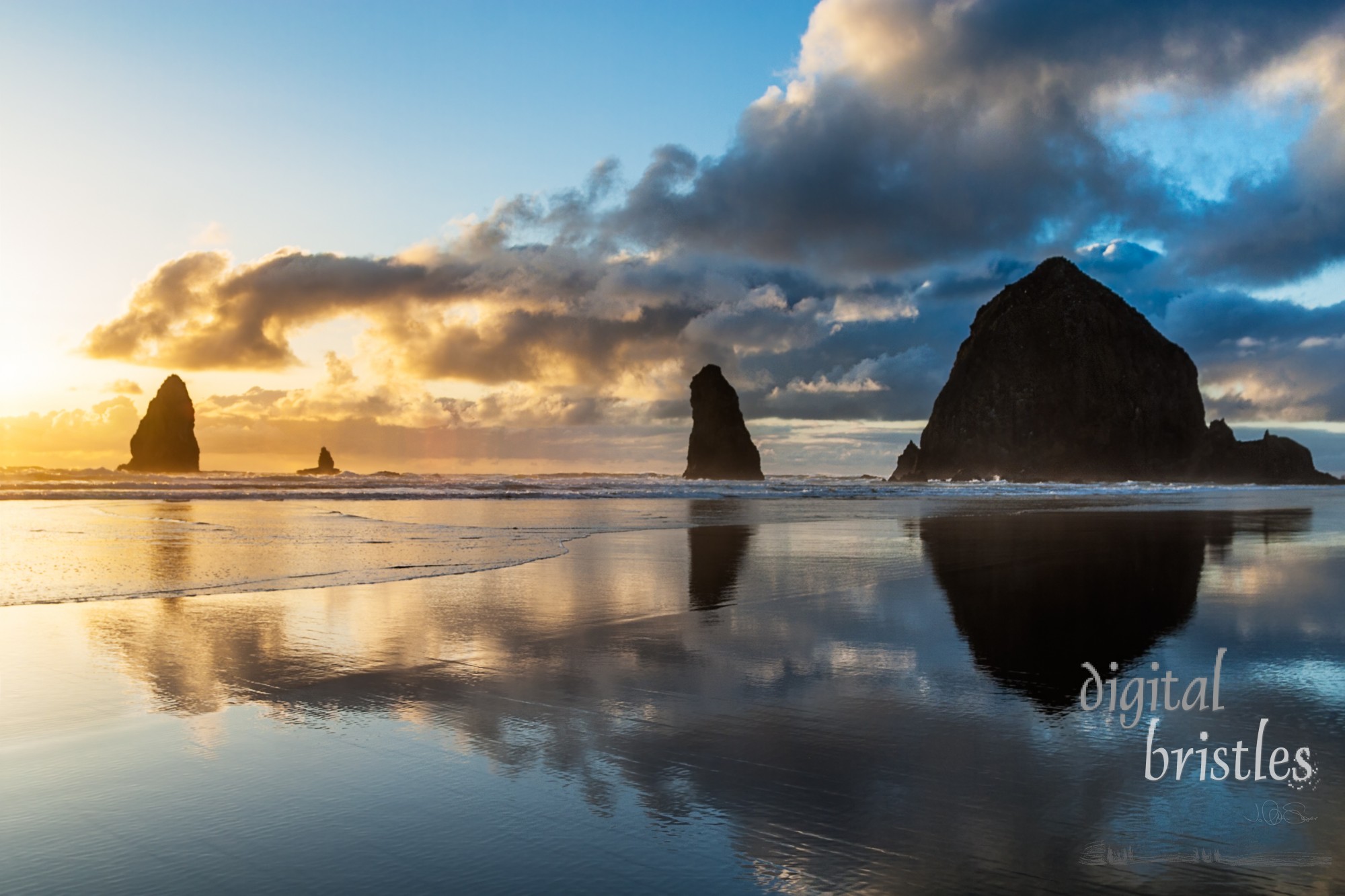 Low tide at sunset on Cannon Beach by Haystack Rock