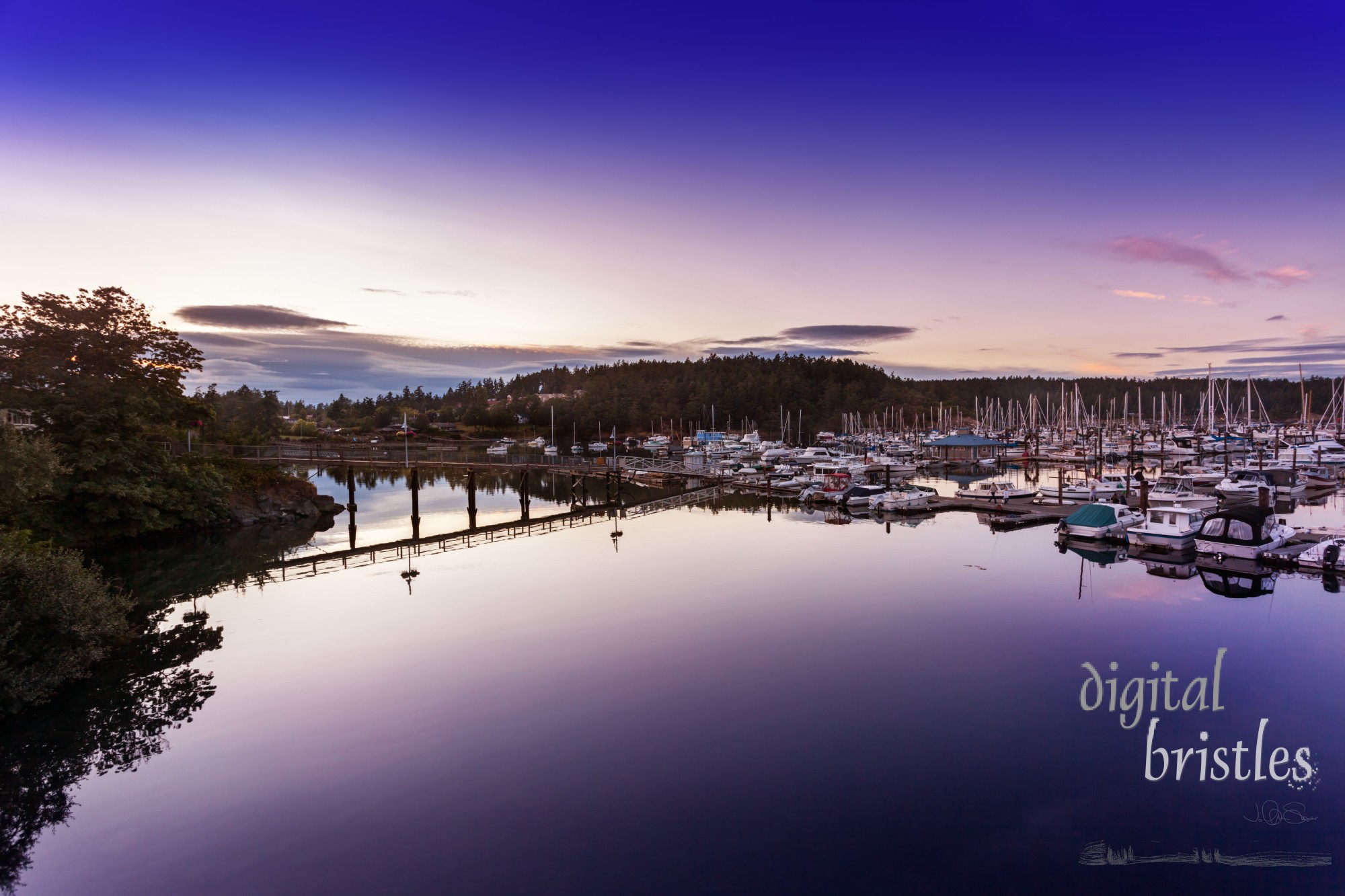 The waters in Friday Harbor's marina are still just after sunset. San Juan Islands, Washington