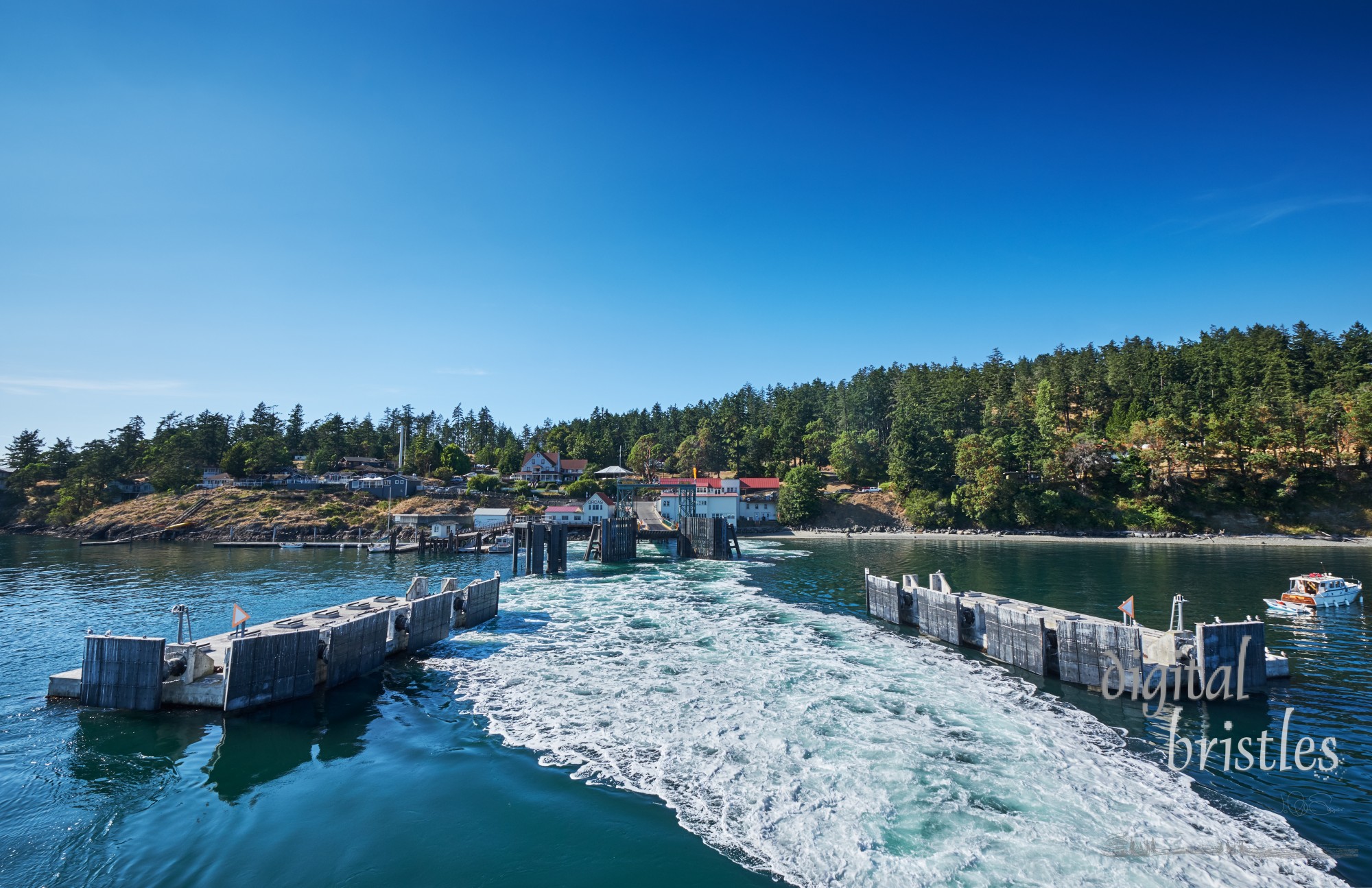 Ocras Island ferry dock with wake of departing ferry