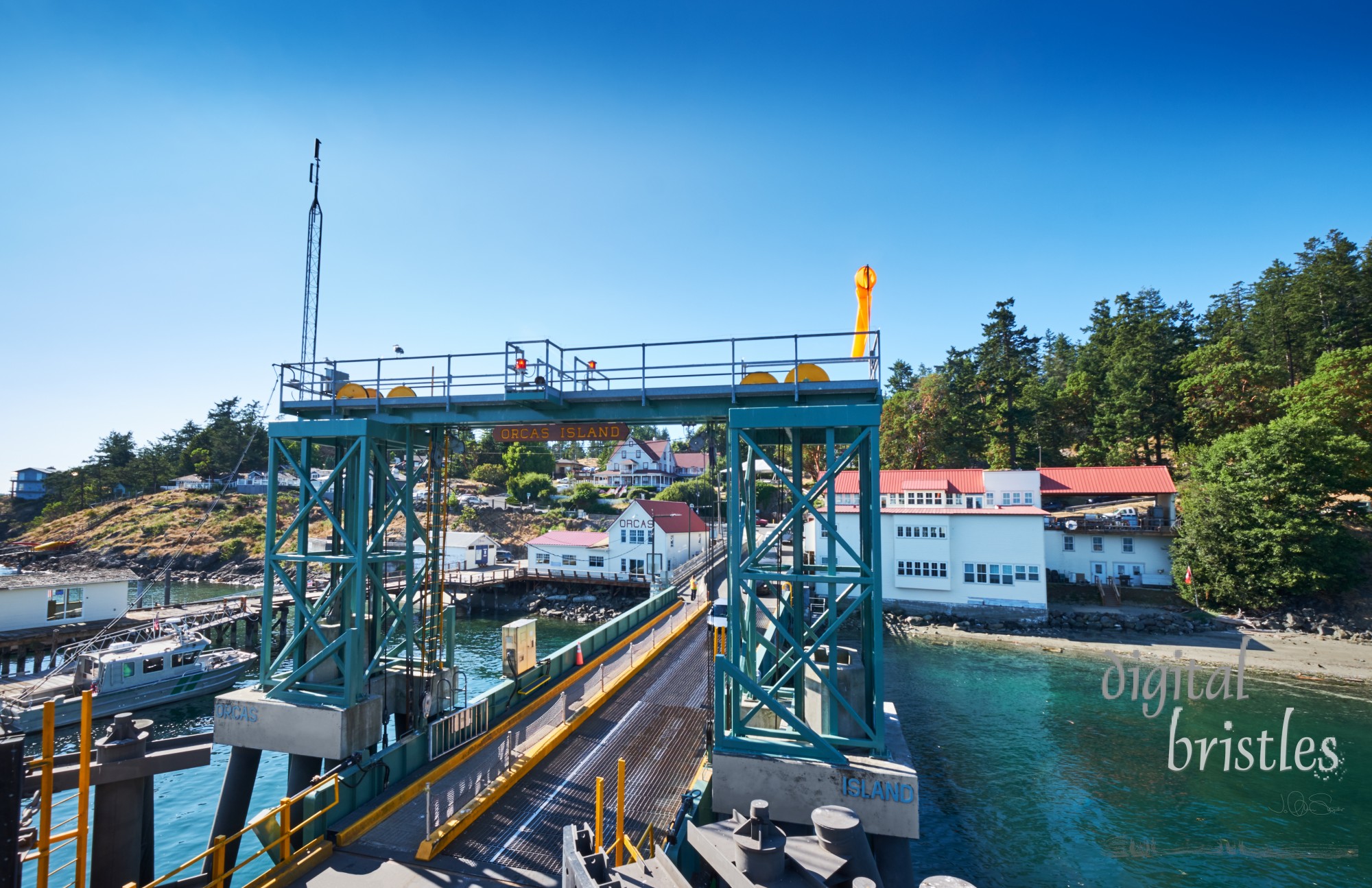 Orcas Island ferry terminal with car loading ramp on a sunny summer afternoon