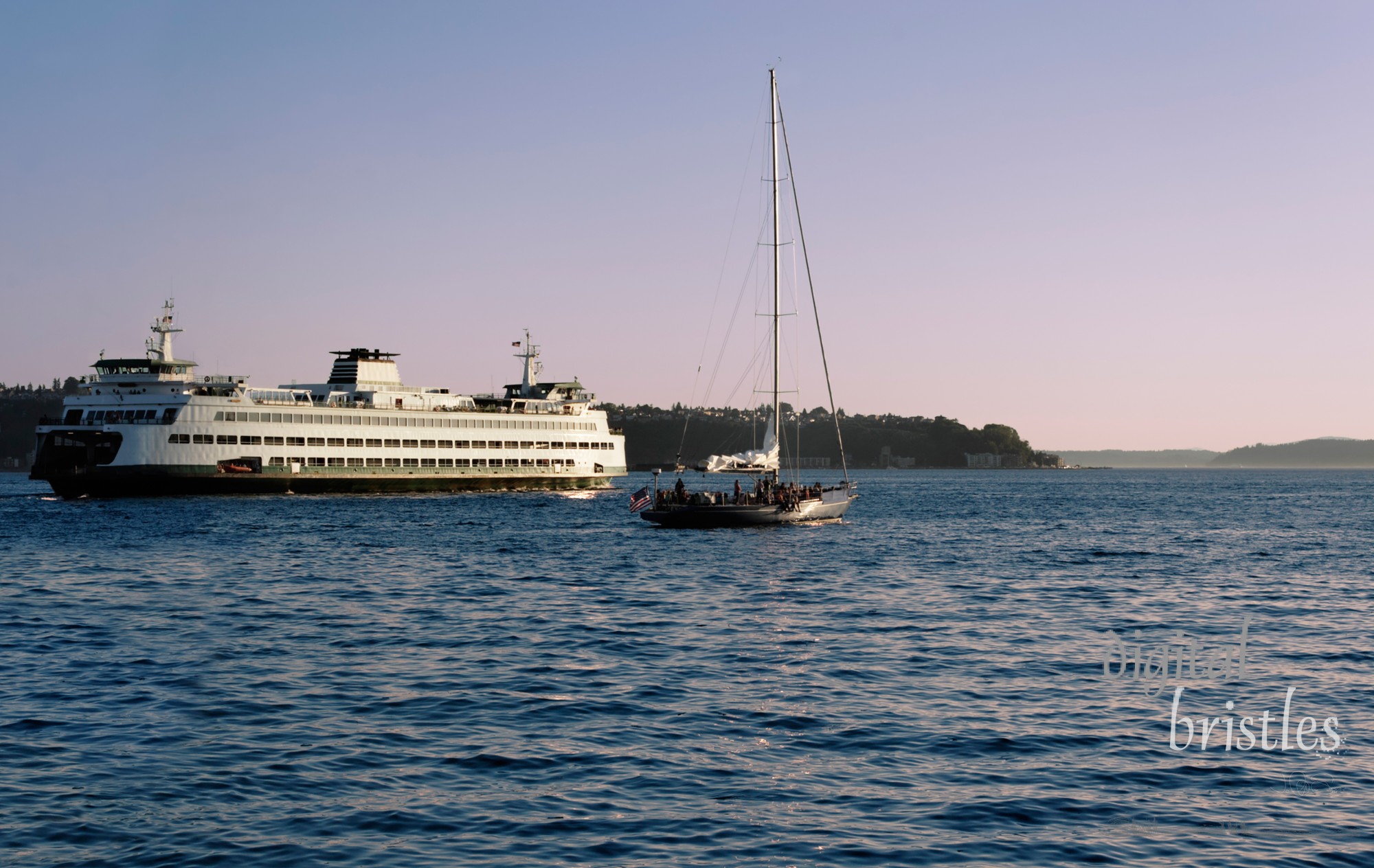 Ferry and sail boat head out of Puget Sound at Sunset