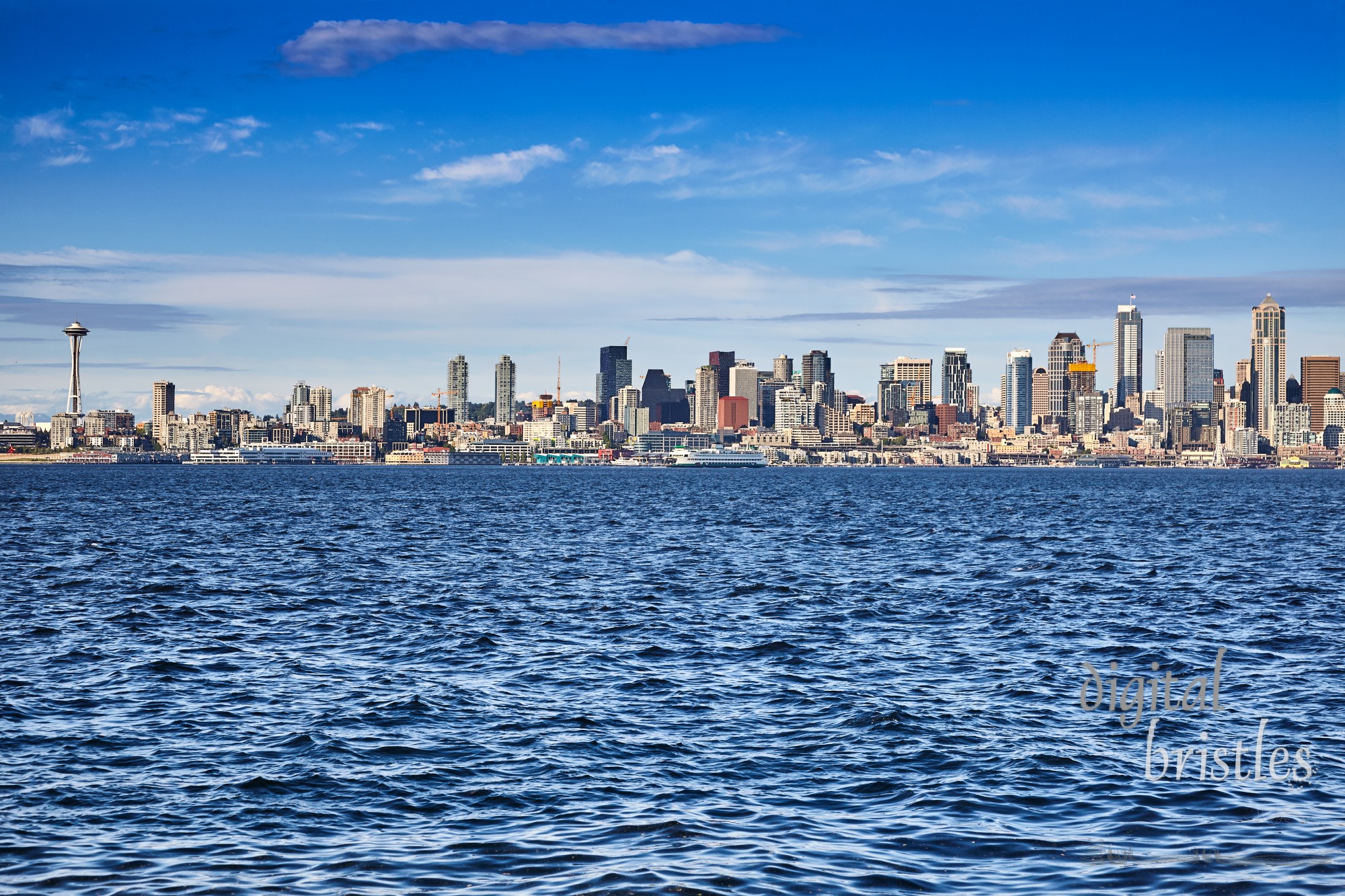 Seattle's waterfront skyline full of construction cranes as the city grows