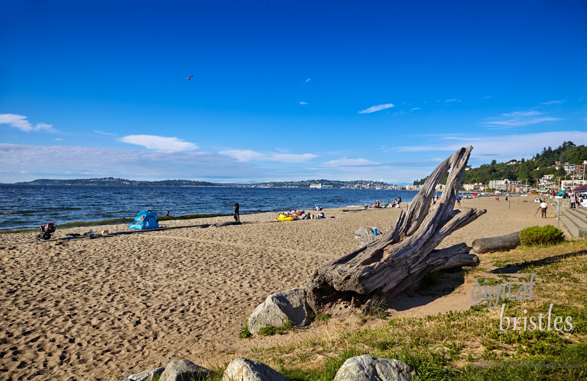 Warm, sunny weather brings people out to Alki Beach, West Seattle, Washington