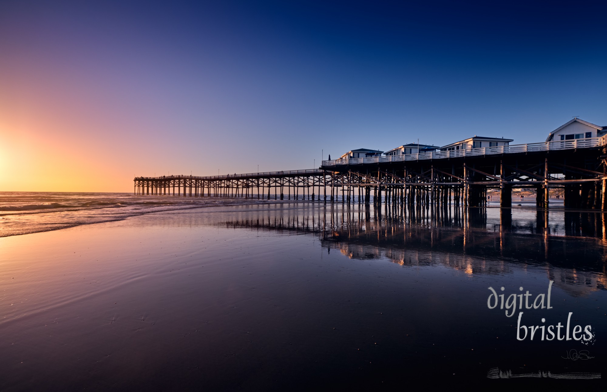 View North along Pacific Beach from Crystal Pier as the sun sets