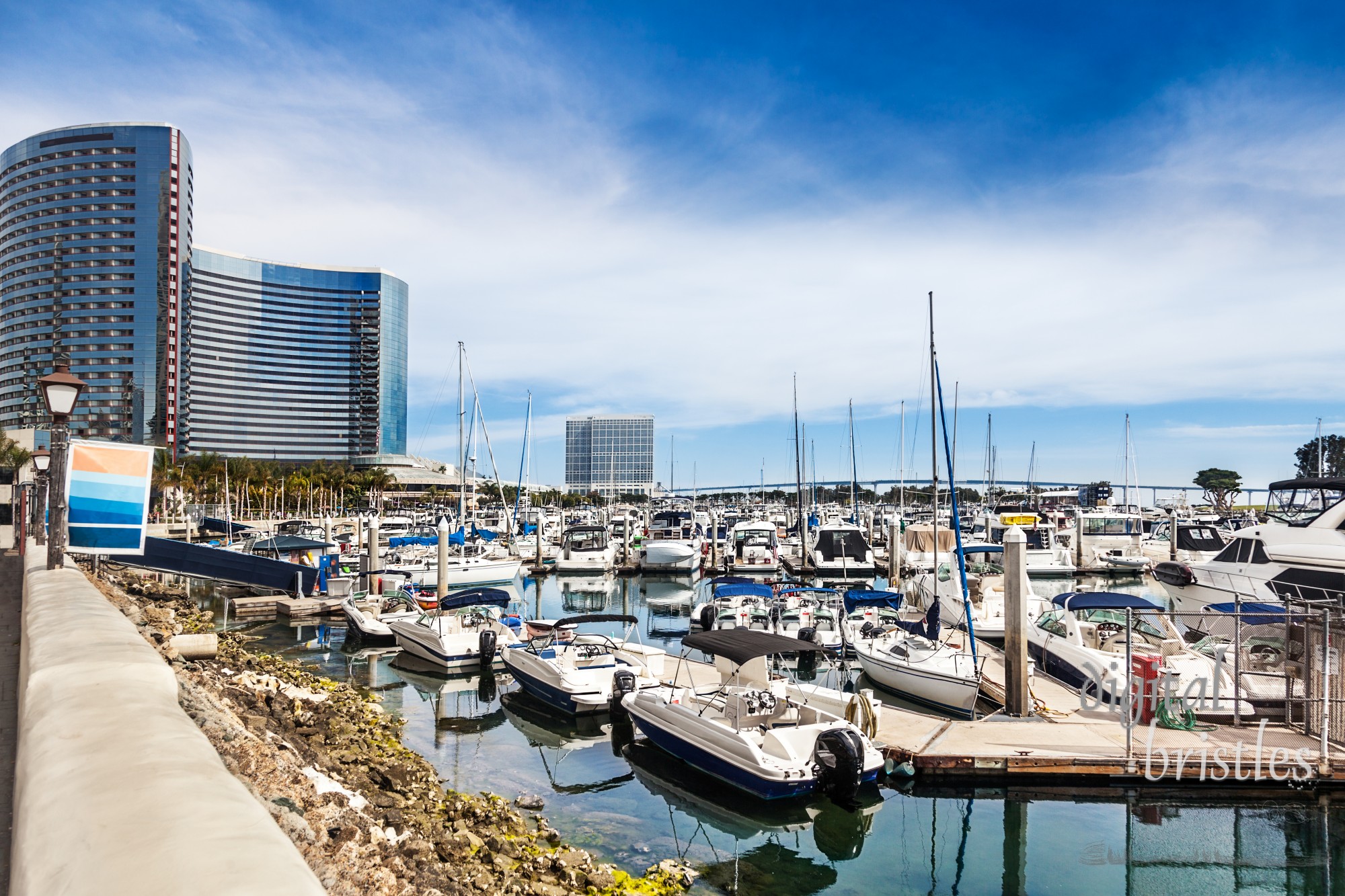 San Diego's Embarcadero Marina,  downtown on San Diego Bay, is packed with small boats. Coronado Bay Bridge in the background