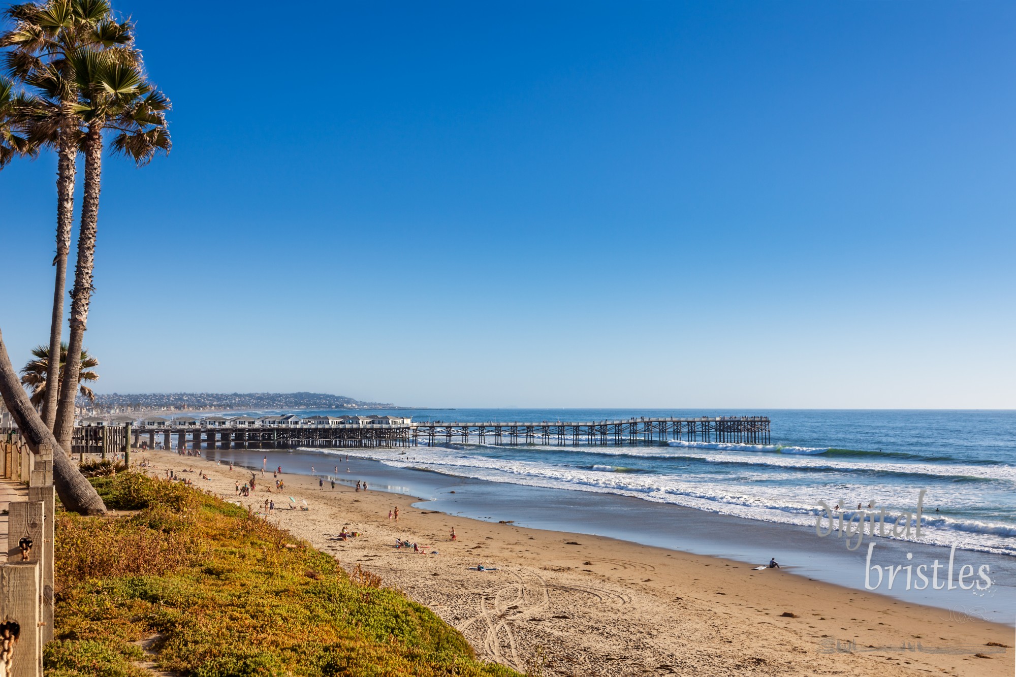 Pacific Beach looking south to the cottages on Crystal Pier and Mission Beach on a sunny Spring afternoon