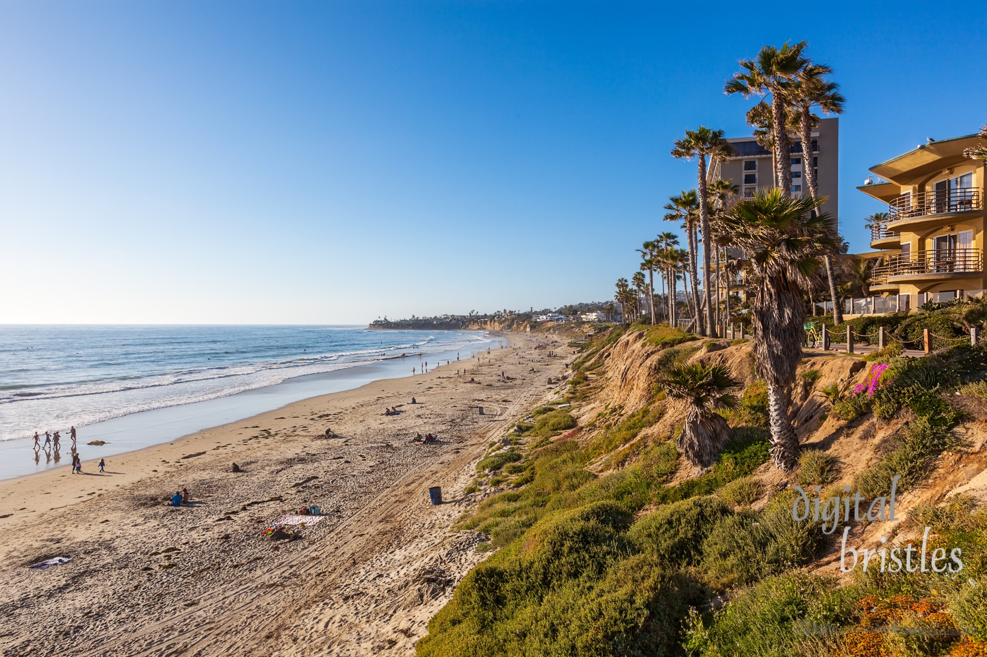 Late afternoon sun warms the bluffs in North Pacific Beach, California