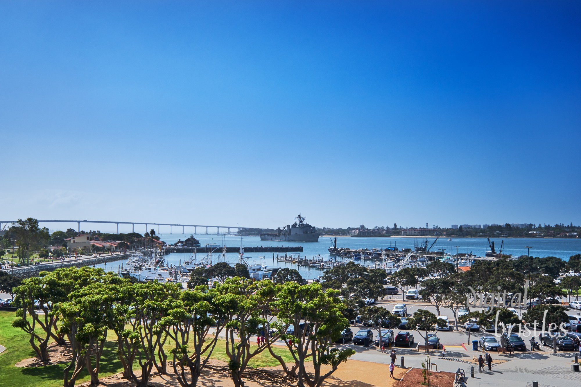 Naval Supply Ship moving past Seaport Village in San Diego Bay