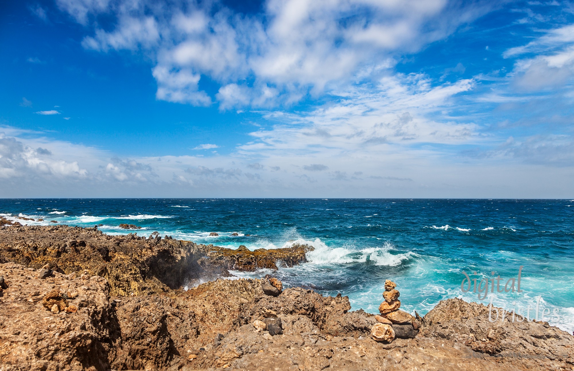 Aruba's windy, rocky north shore with rough seas even on a sunny Spring day