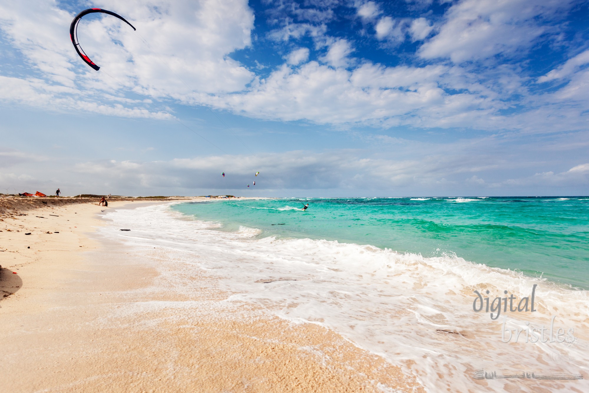 San Nicolas, Aruba, April 6, 2012.  Kitesurfers enjoy windy Boca Grandi beach. It's on the east side of Aruba where steady trade winds and challenging waves make this an ideal beach for kiteboarding or kitesurfing.