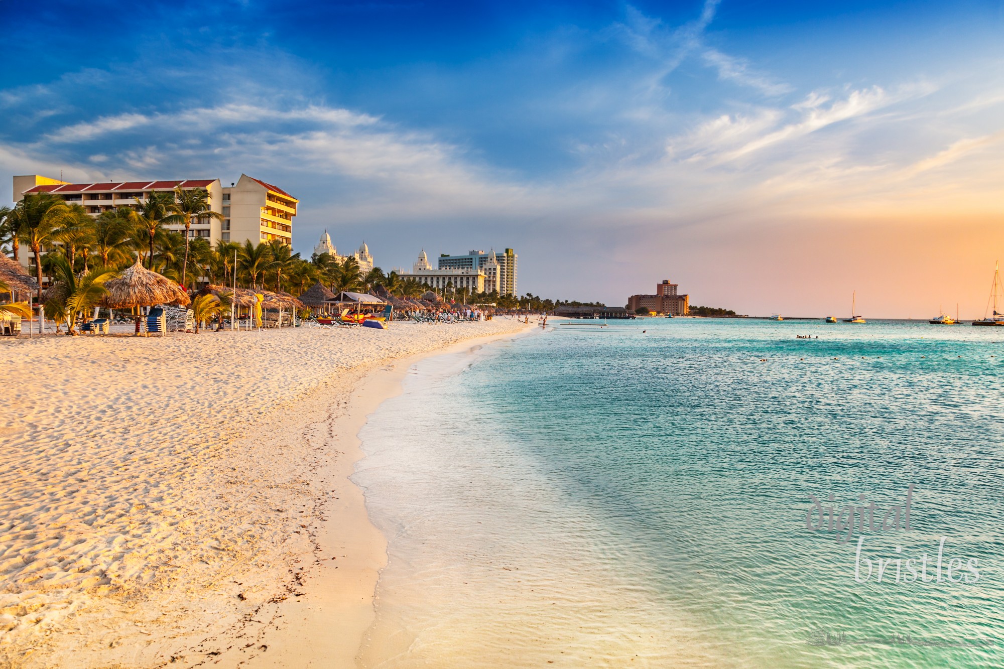 Chairs stacked up at the end of the day on Aruba's busy Palm Beach