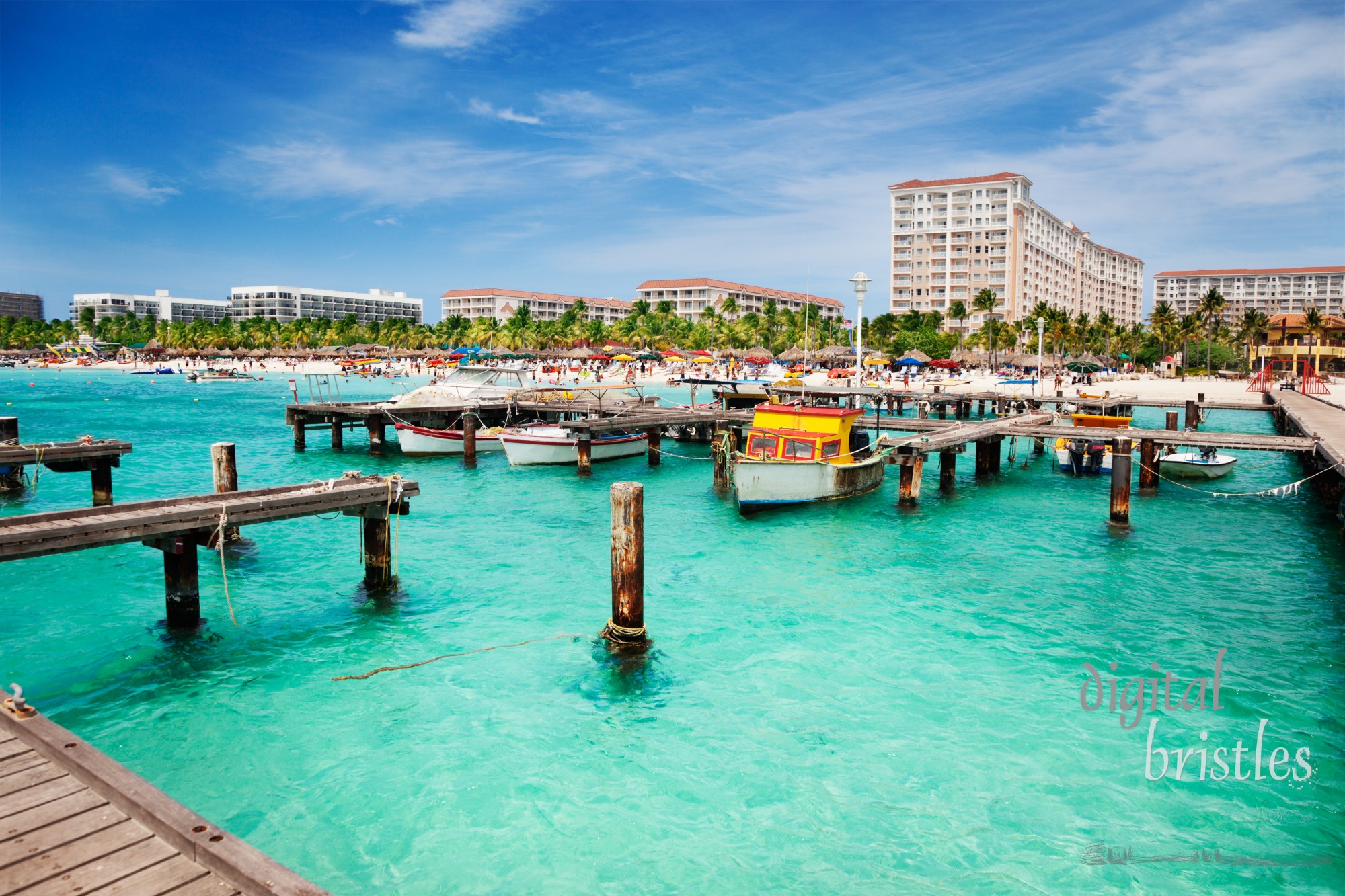 Dock on Palm Beach, Aruba on a sunny Spring afternoon