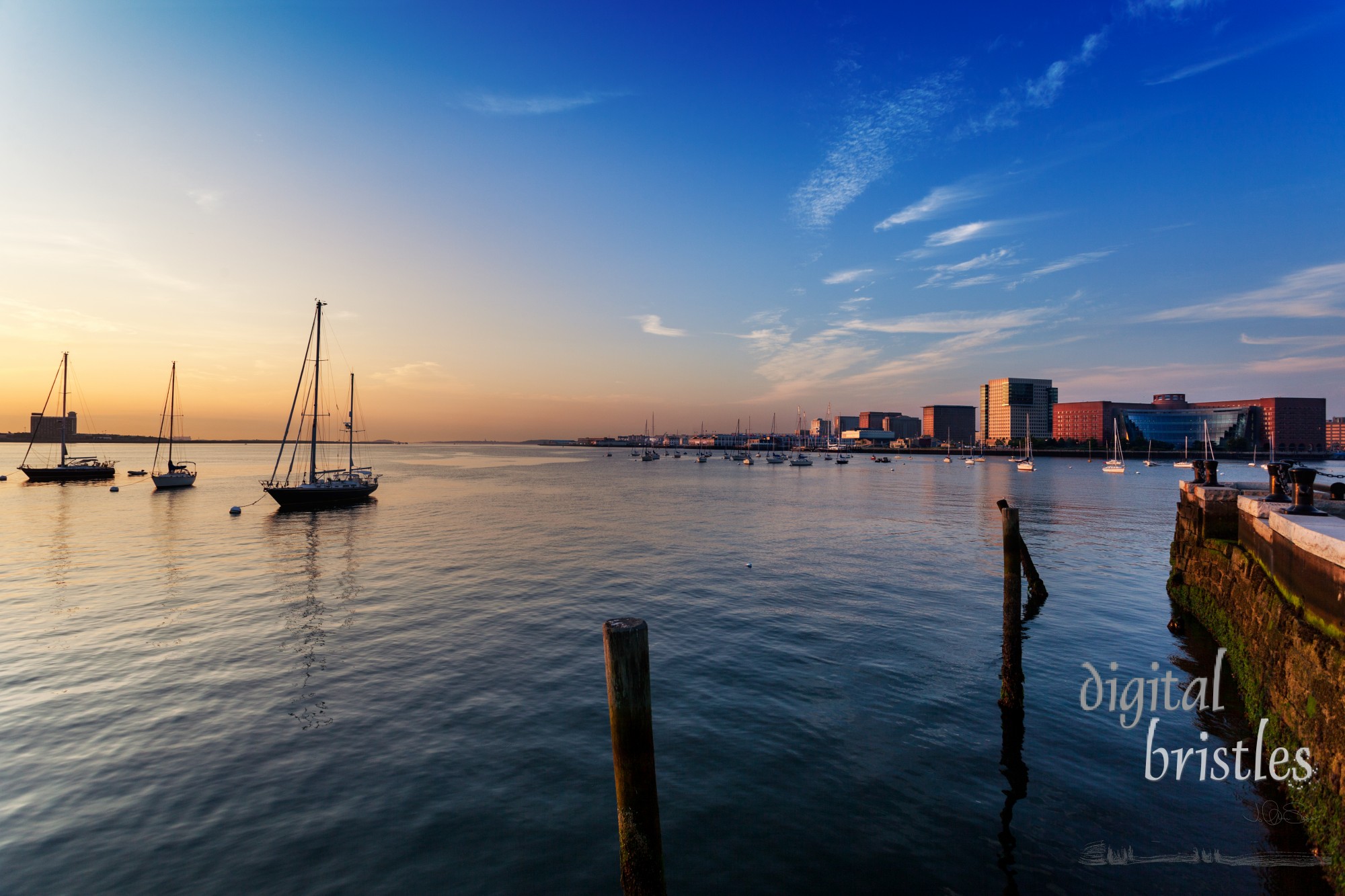 Moakley Federal Courthouse and World Trade Center face Boston Harbor sunrise