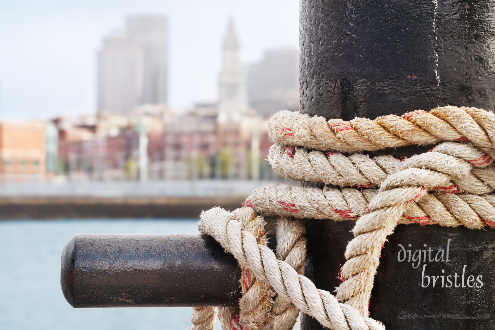 Heavy ropes secure a ship on the Charlestown side of Boston Harbor