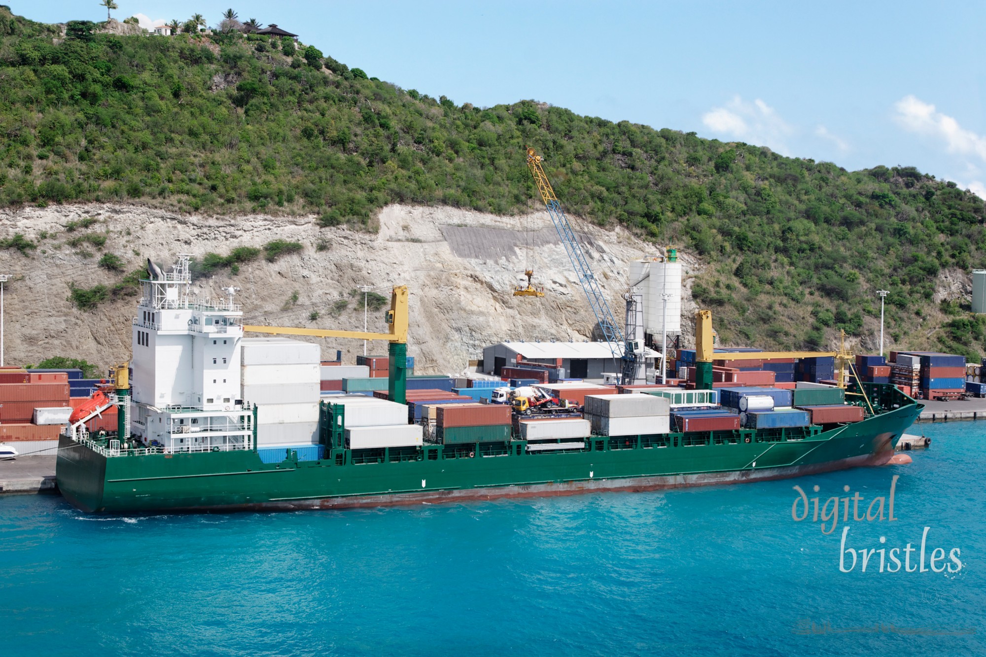 Cargo ship loading at the Caribbean port  of Sint Maarten