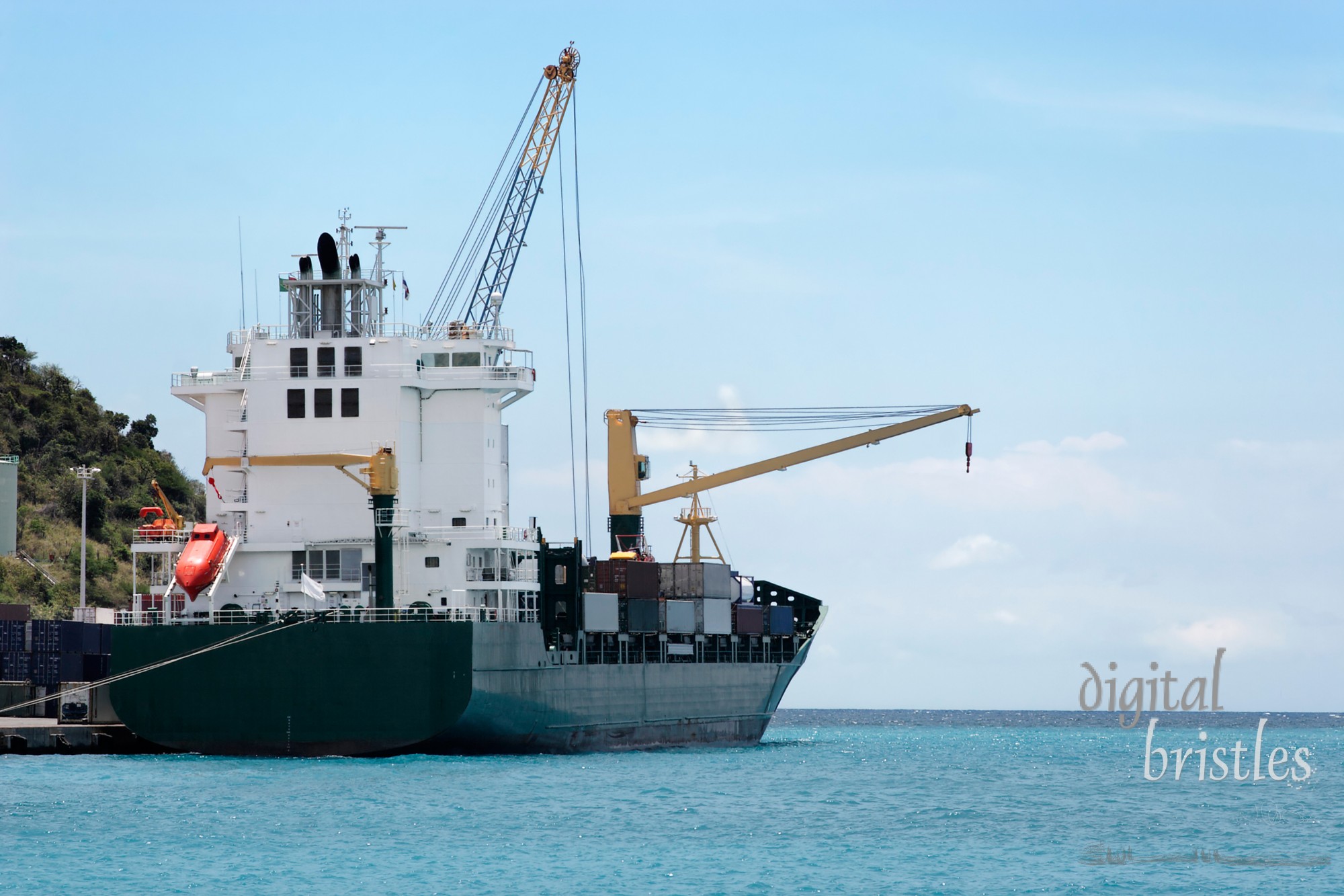 Cargo ship making readyto leave a Caribbean island port (Sint Maarten)