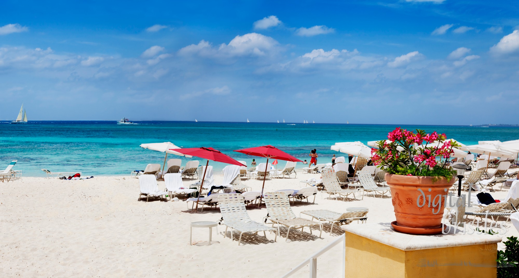 Fun in sand & and water on Seven Mile Beach, Grand Cayman