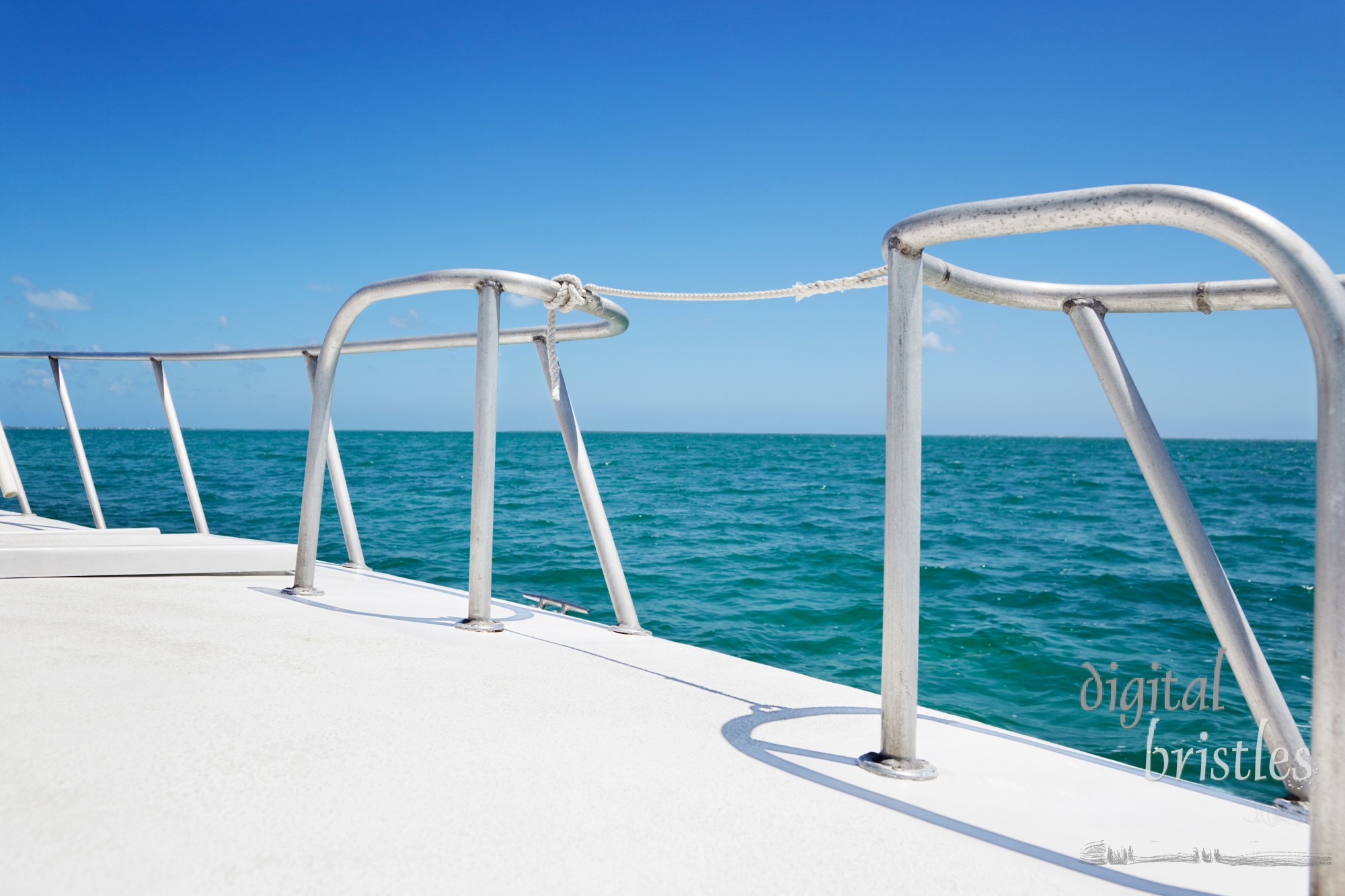 Boat railings and warm tropical waters