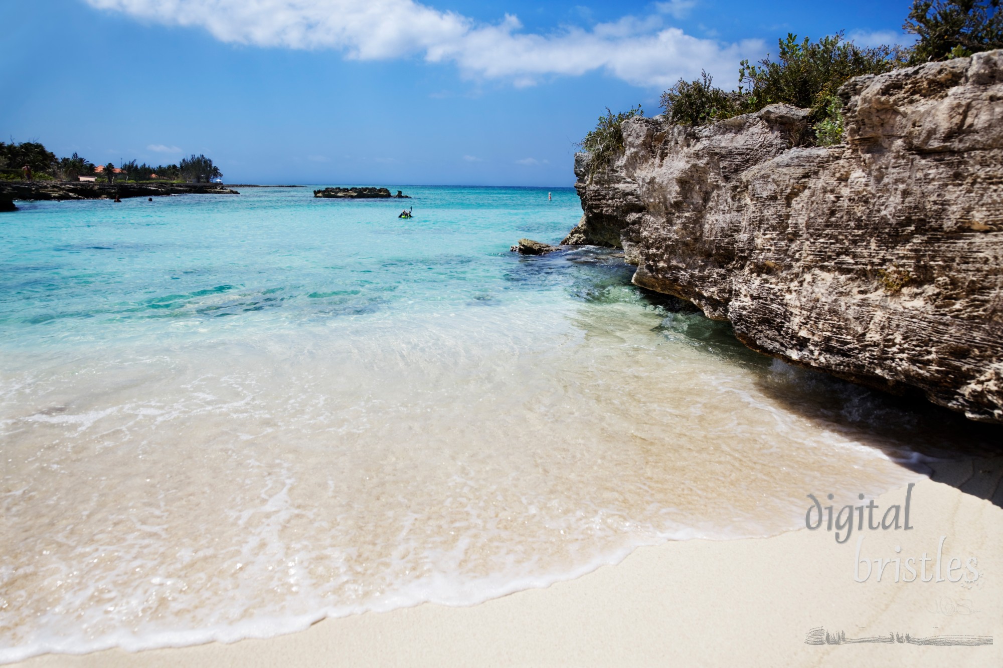 Man gets mask and snorkel on at Smith Cove, Grand Cayman