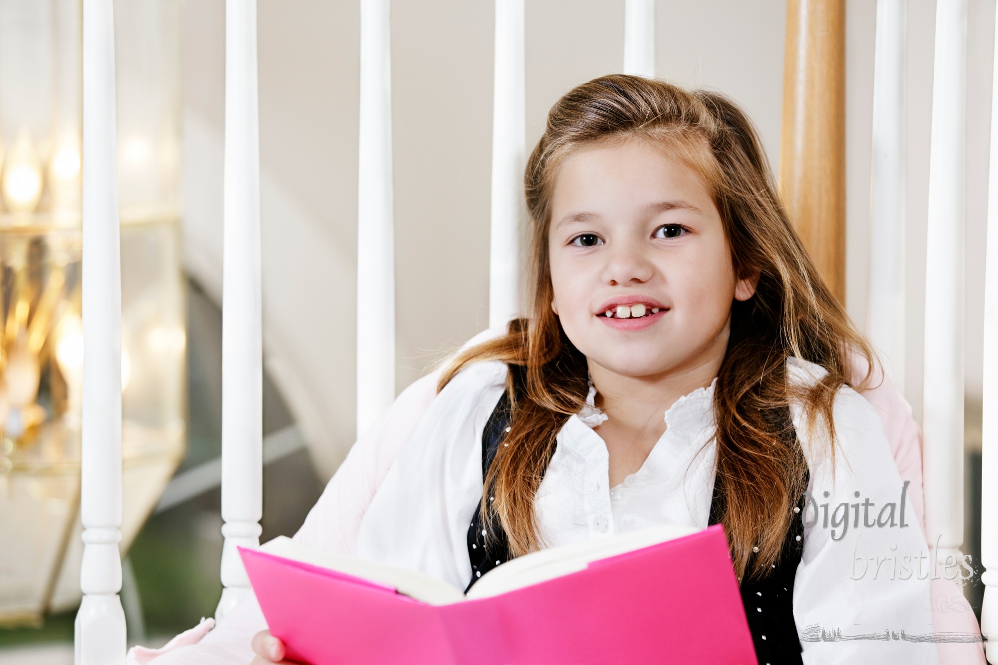 Young girl reading her book