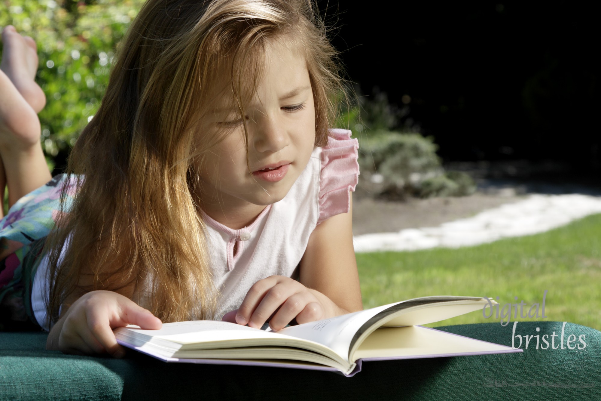 Young girl relaxing and reading