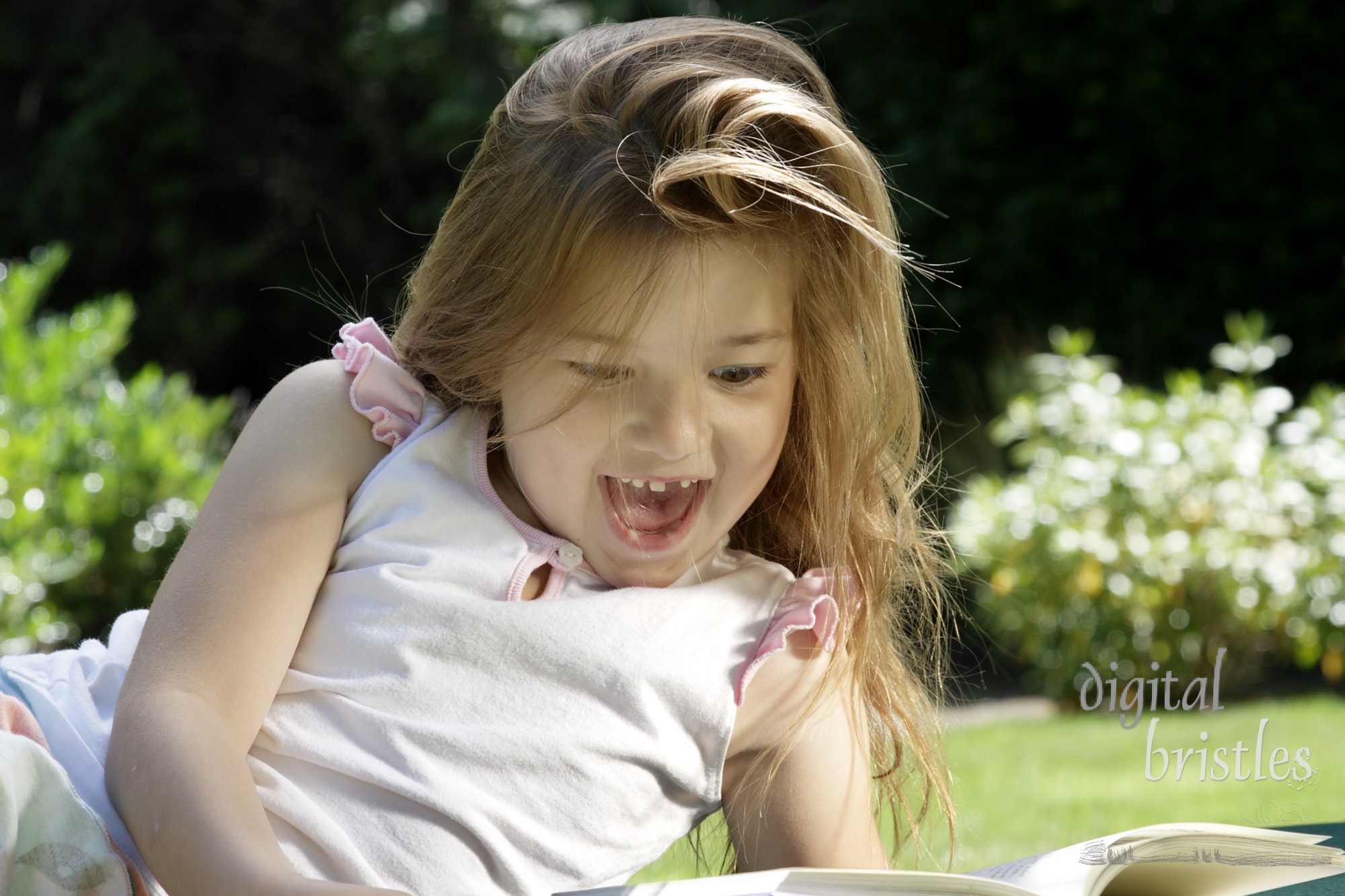 Young girl astonished at what she's reading