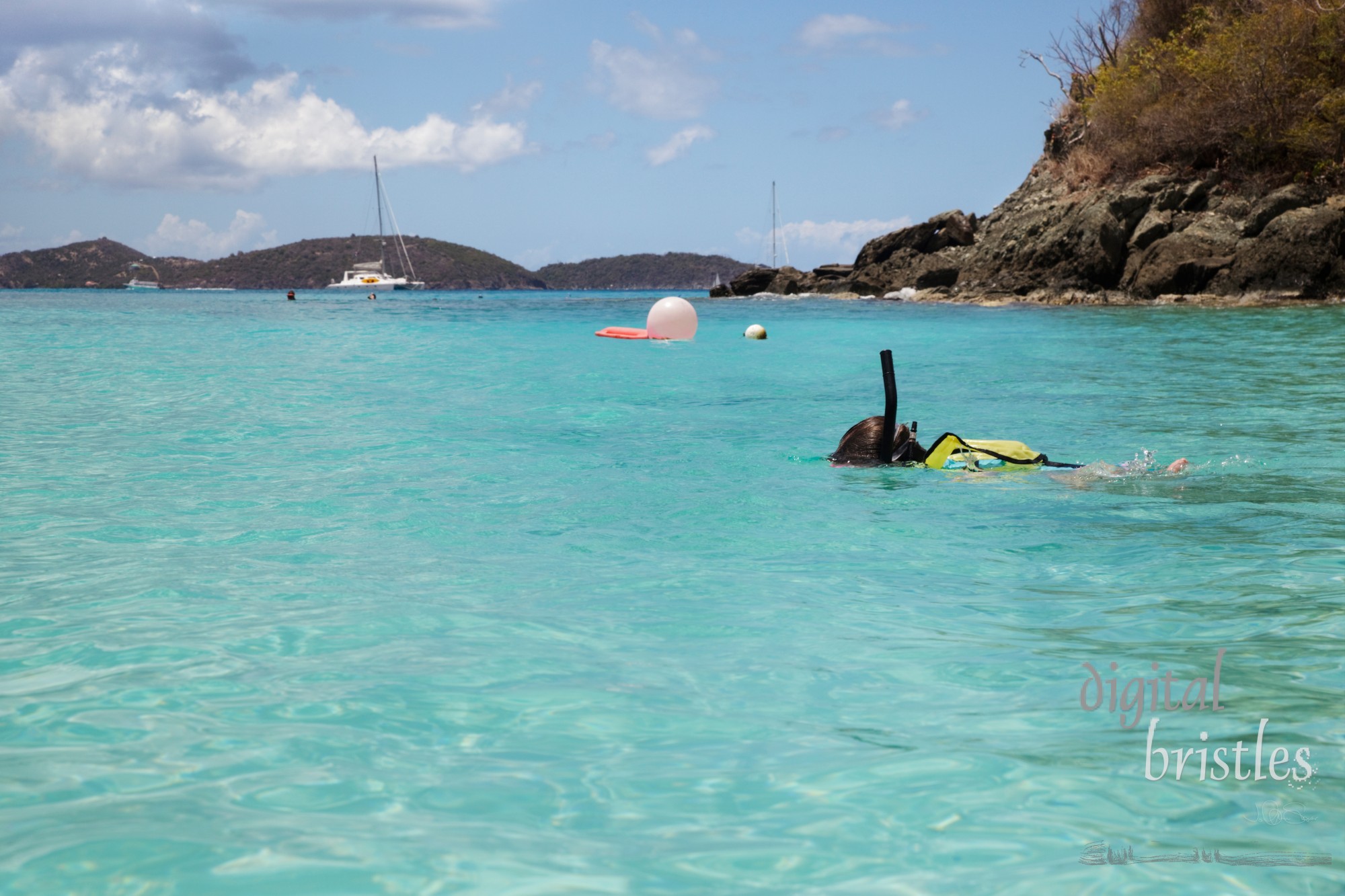 Young girl swims with snorkeling gear, St. John