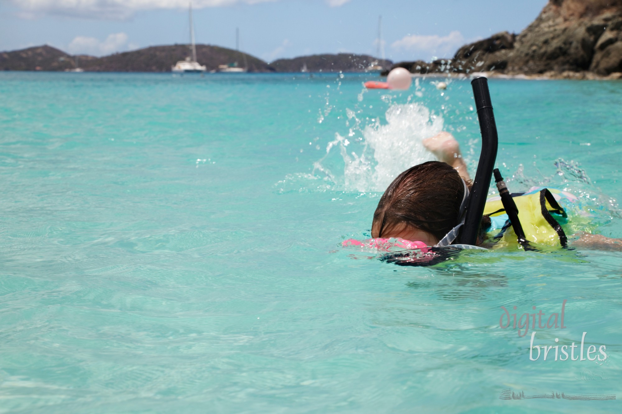 Young girl swims with snorkeling gear, St. John