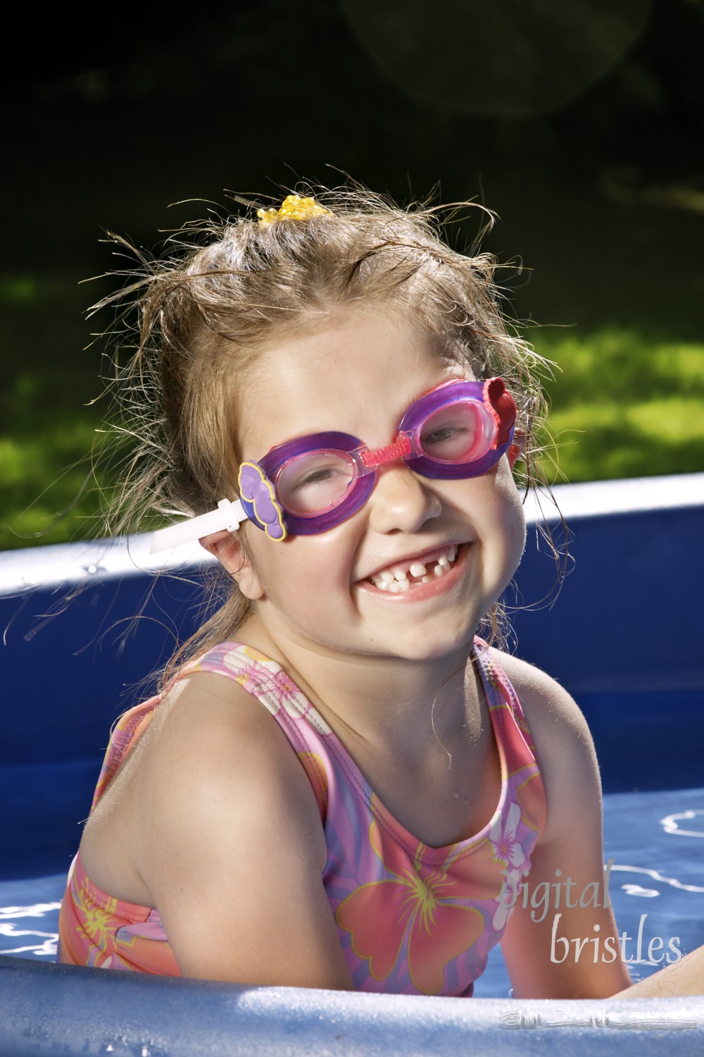 Young girl with new swim goggles to try out