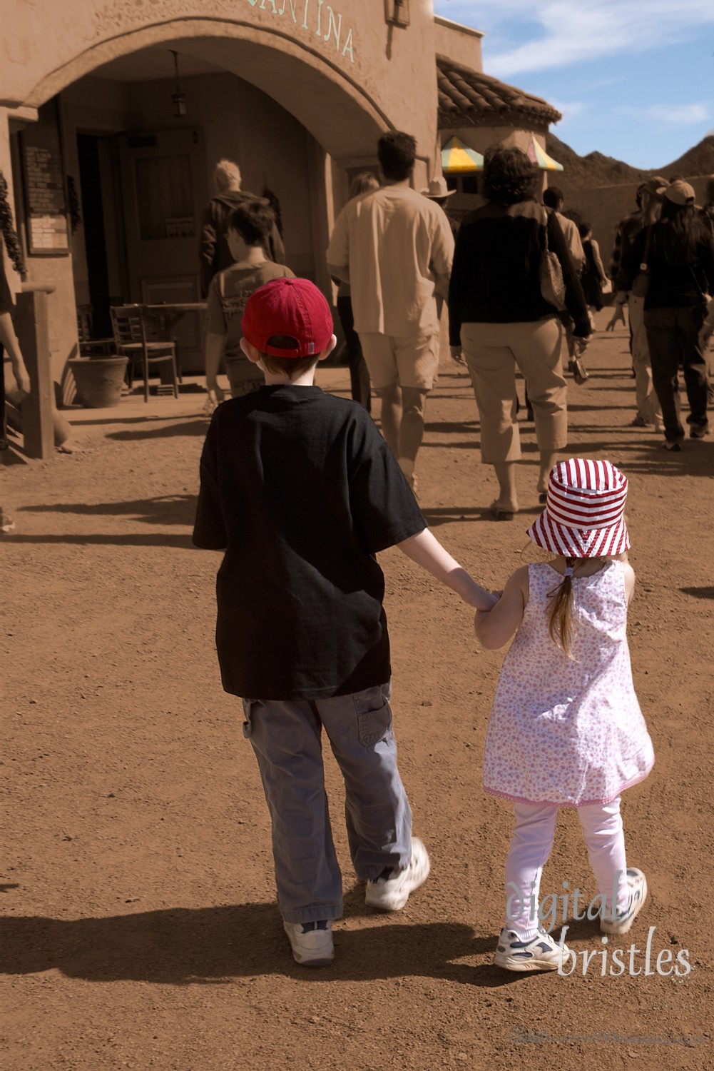 Alone in a crowd. Brother and sister hold hands and stick together