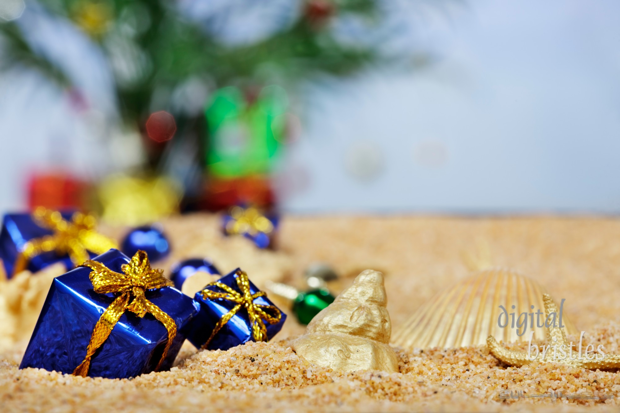 Christmas ornaments in the sand - blue packages