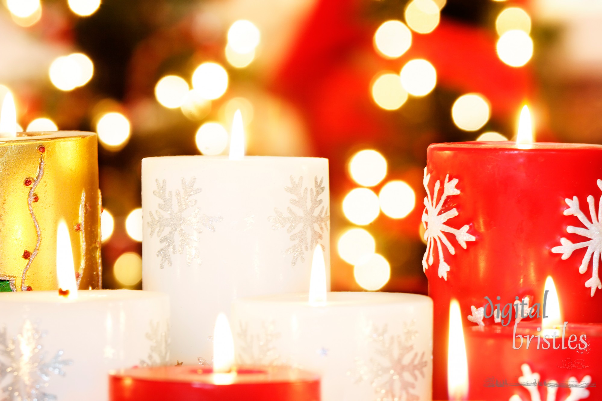 Collection of Christmas candles with blurred light background