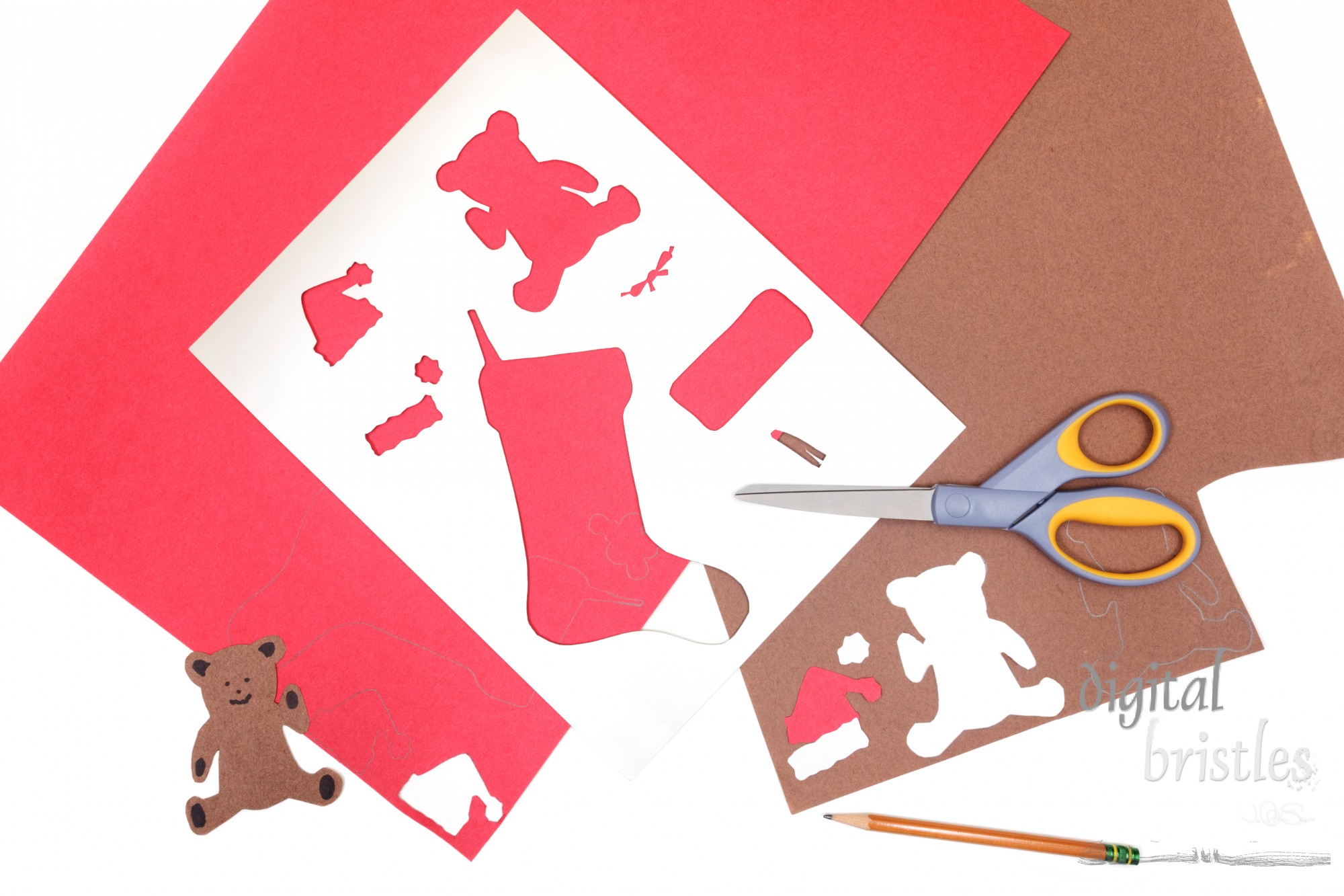 Construction paper, pencil and scissors to make Christmas crafts