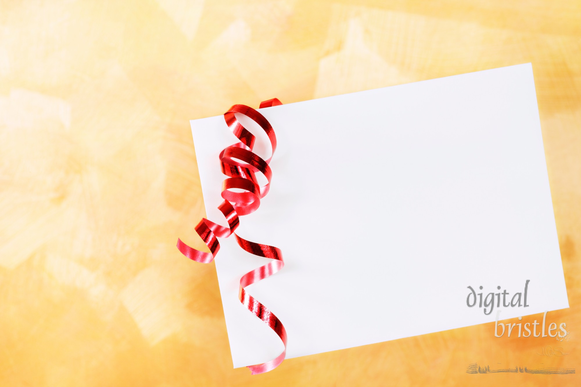 White envelope with red curling ribbon over a gold hand painted background