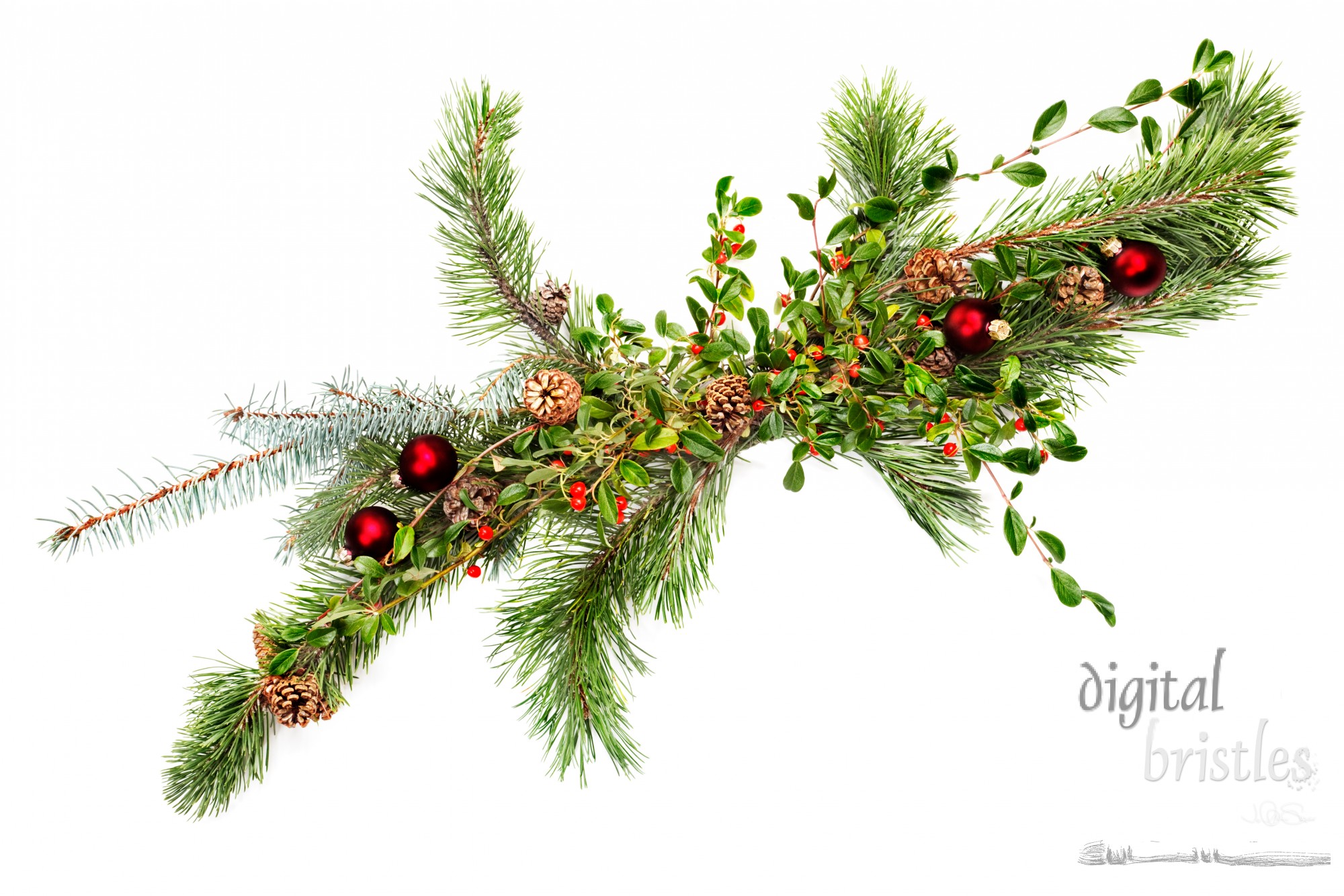 Holiday garland with ornaments, pine & spruce branches, pine cones and evergreen with berries (Common Bearberry/Kinnikinnick). Shot straight down but at an angle to get maximum length in frame.