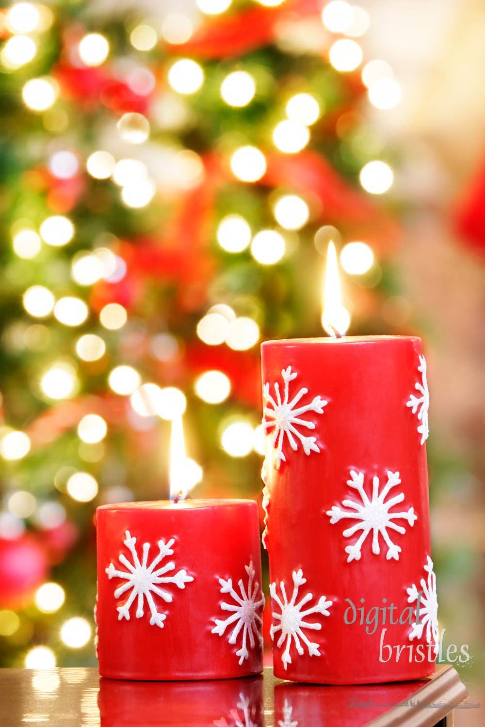 Christmas candles against blurred holiday lights background