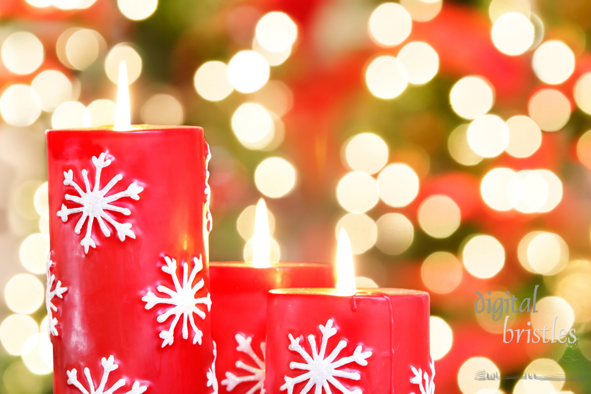 Christmas candles against blurred holiday lights background