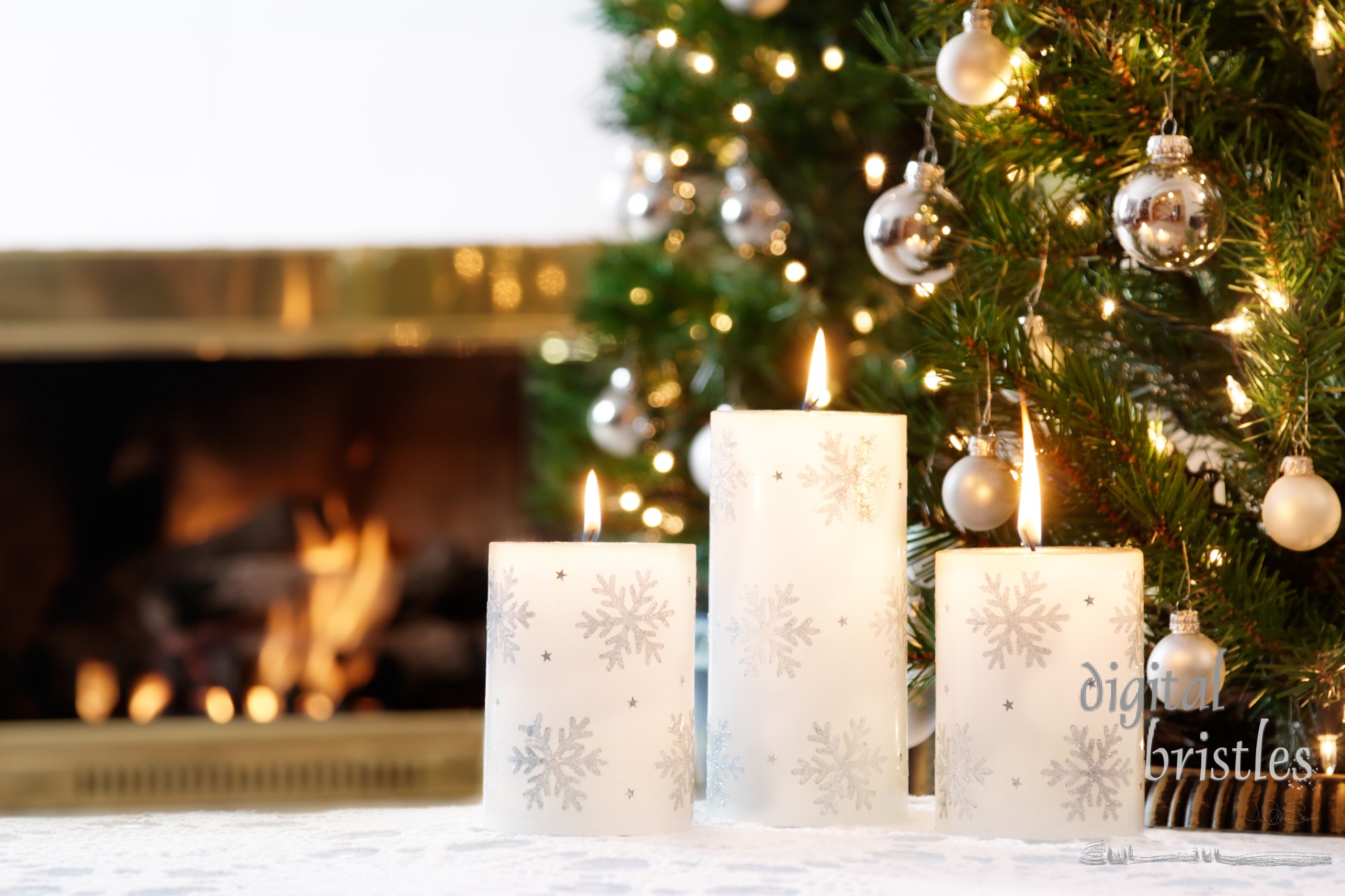 Snowflake candles and glittering decorations by a warm fire