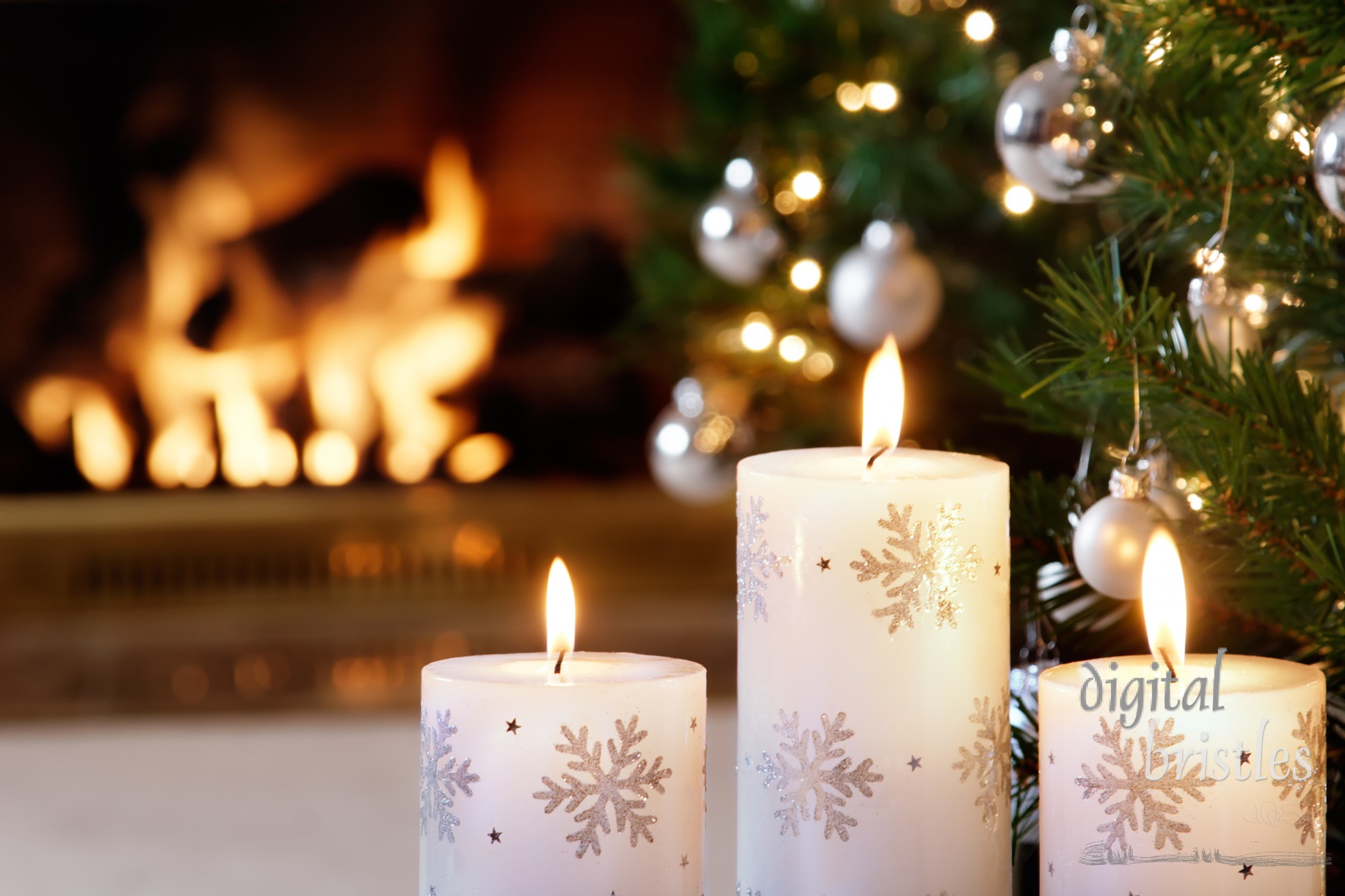 Snowflake candles and glittering decorations lit by the flickering fire