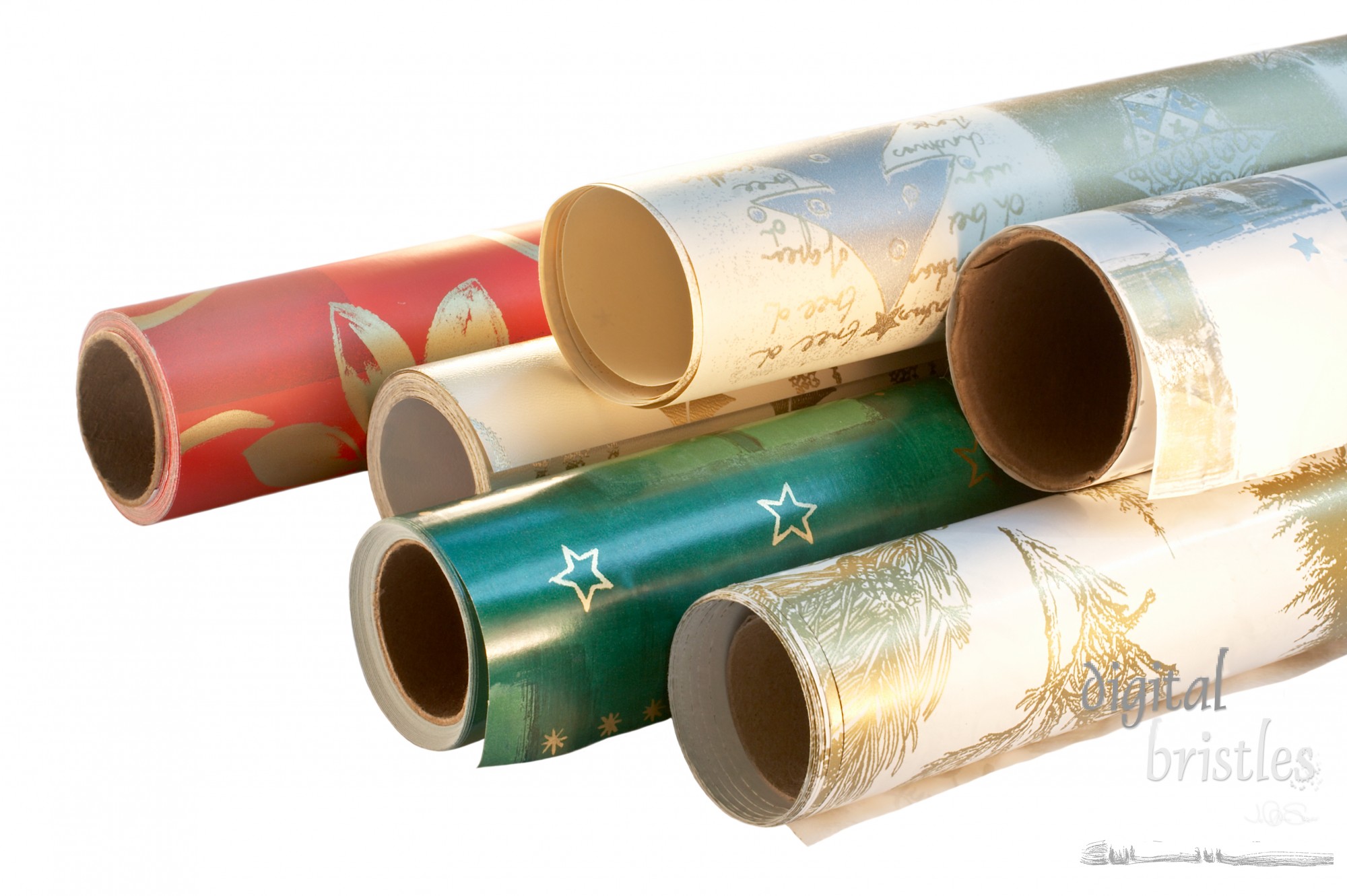 Stacked rolls of Christmas/holiday wrapping paper