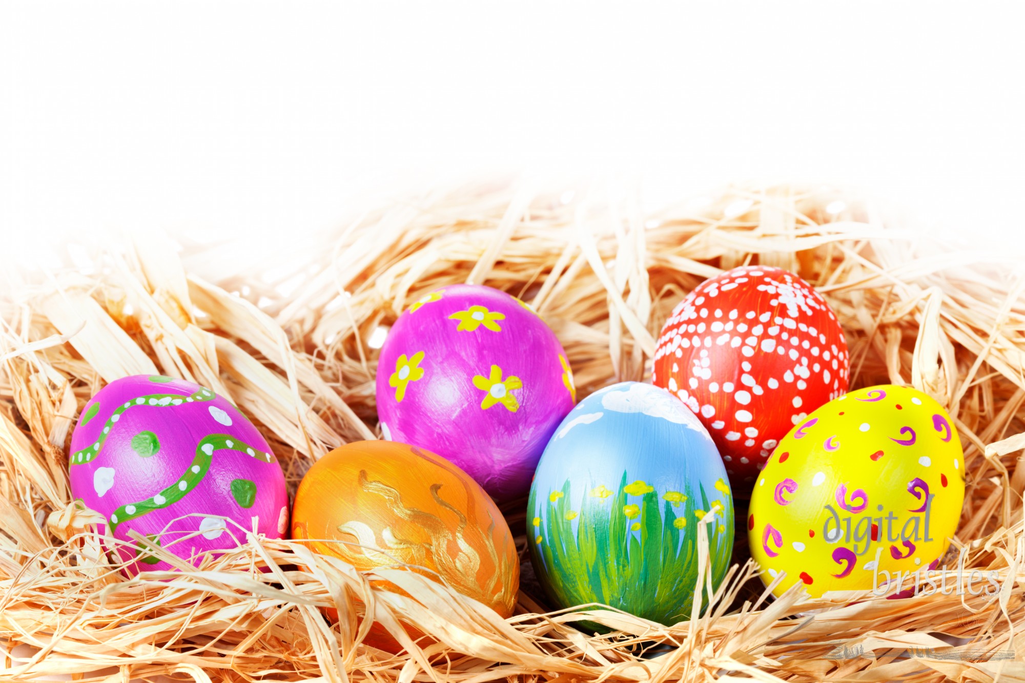 Hand painted Easter Eggs in a raffia nest