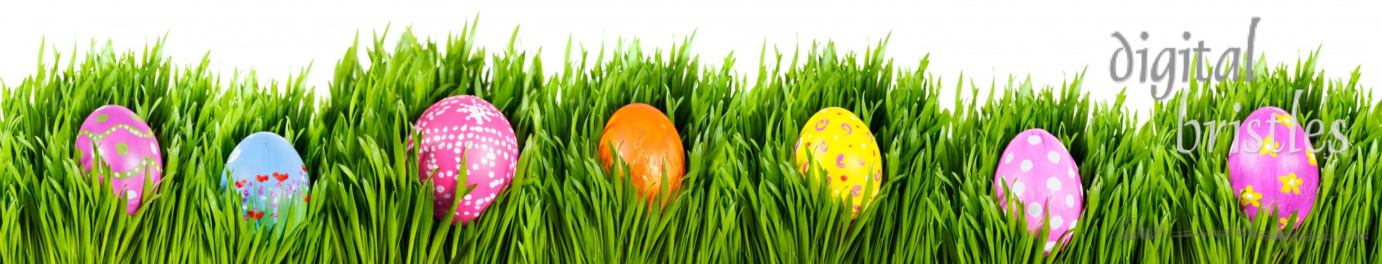 Hand painted easter eggs nestled in grass