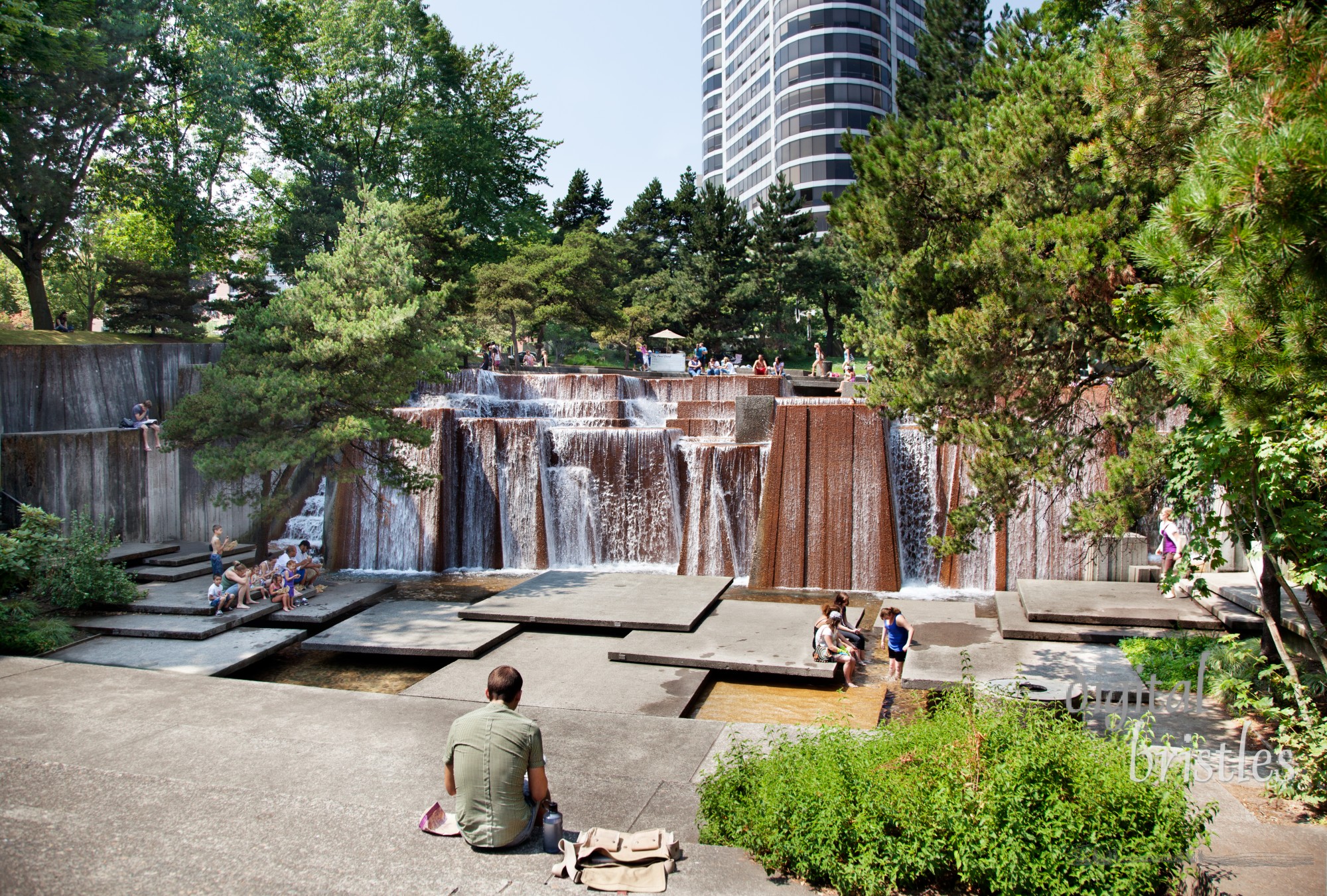 Waterfalls fill a city block at Keller Fountain Park, SW 3rd Ave & Clay St. Built in 1970, the terraces and platforms suggest Pacific Northwest waterfalls where families cool off on a hot summer afternoon and others eat lunch outside.