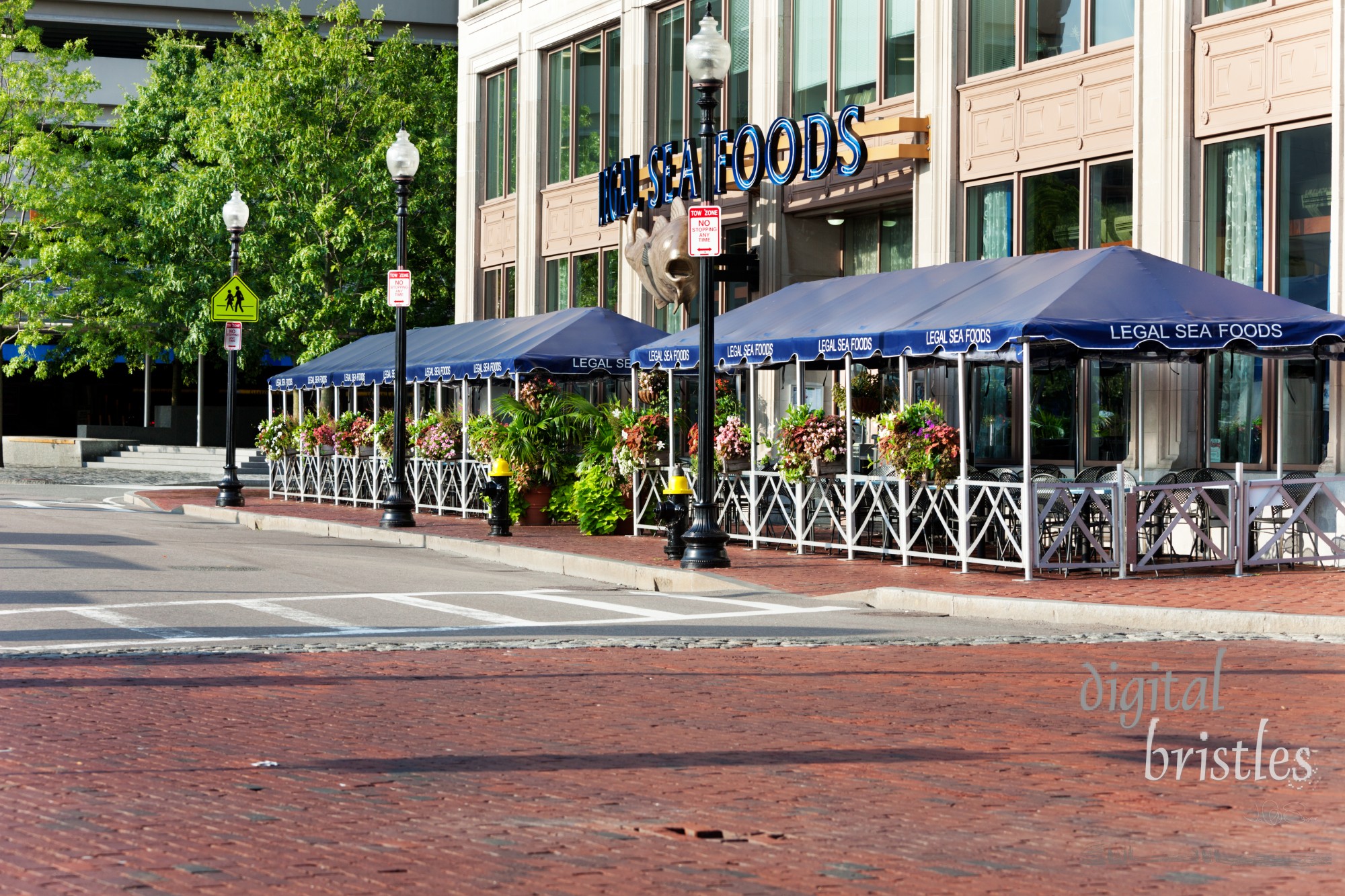 Legal Seafoods restaurant faces Boston Harbor at Long Wharf. Legal Seafoods is a local family-owned chain of seafood restaurants that started in 1968 in Cambridge adjacent to the fish market the family owned. Long Wharf is a busy tourist area on Boston Harbor.