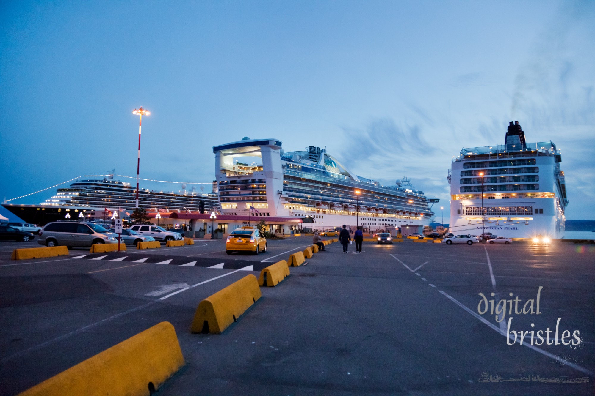 Cruise ships docked at night at the Ogden Point deepwater terminal, Victoria, BC. Built in 1918, it has been enhanced to accommodate a growing number of cruise ships - in 2008, it reached 150 in one season.