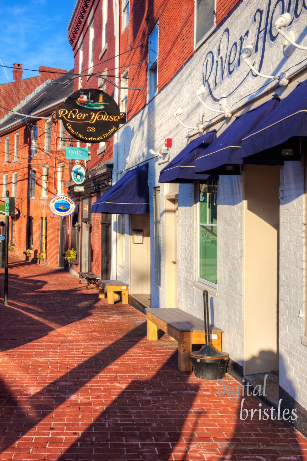 Portsmouth, New Hampshire, Aug 22, 2012. Gently curved Bow Street follows the shape of the bank of the Piscataqua River. Brick buildings on Bow Street, now occupied by restaurants and shops, were all built after the December 24, 1806 fire which destroyed the previous timber structures.