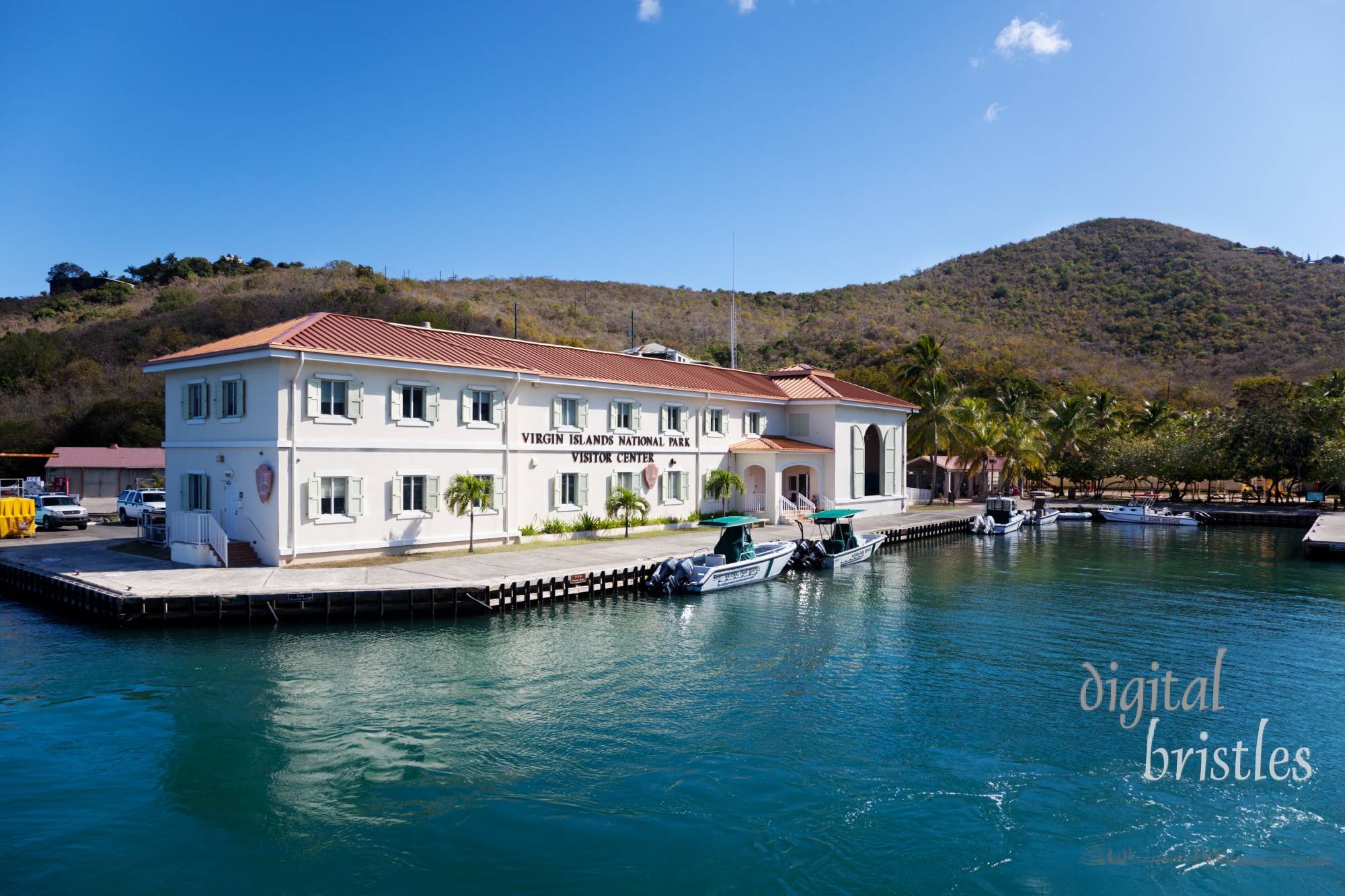 Virgin Islands National Park Visitor Center dock in Cruz Bay. The 7,000 acre National Park covers nearly half of the island of St. John and the center has historical exhibits and artifacts covering ancient times to the sugar cane plantations.