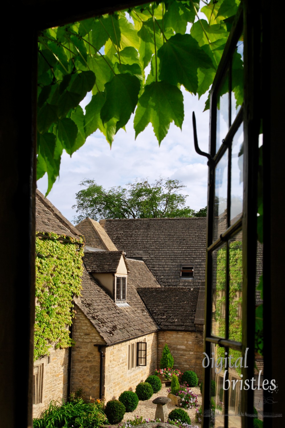 View through a cottage window into the courtyard